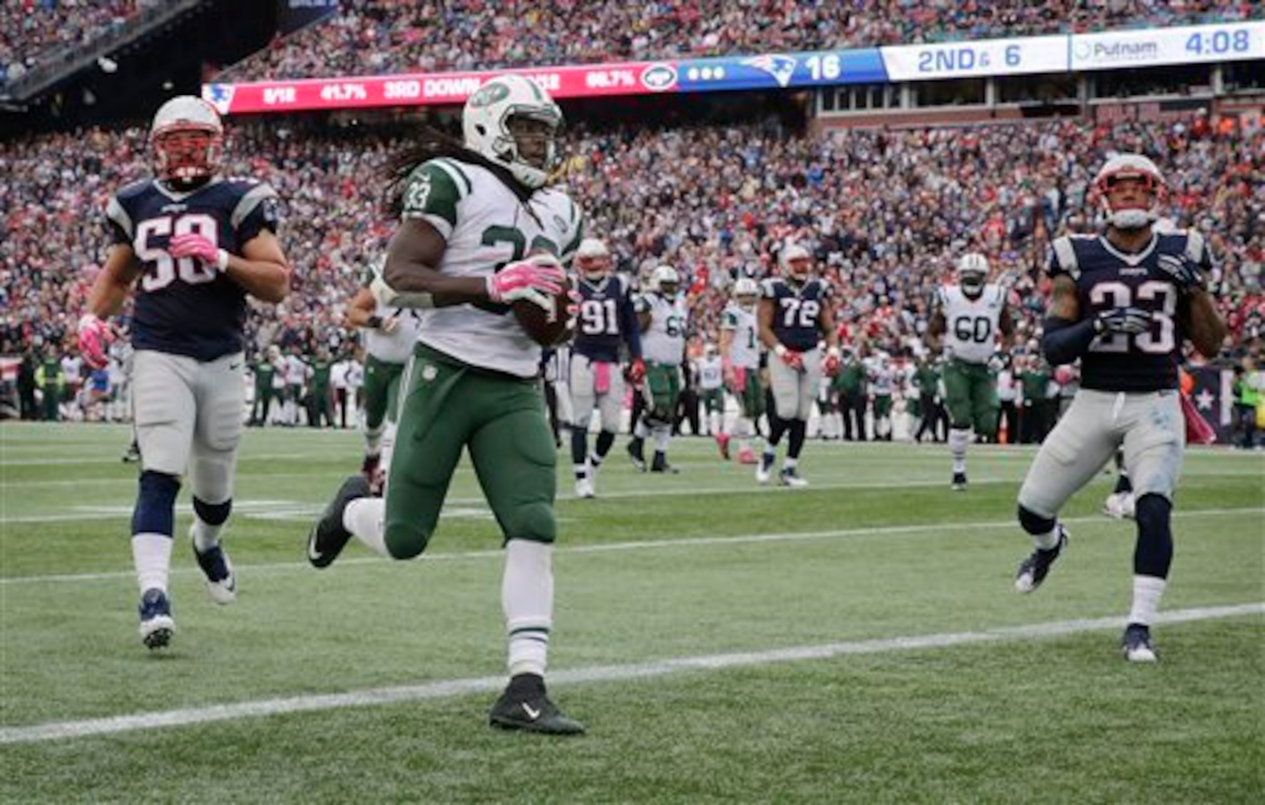 Chris Ivory scores a touchdown against the Patriots