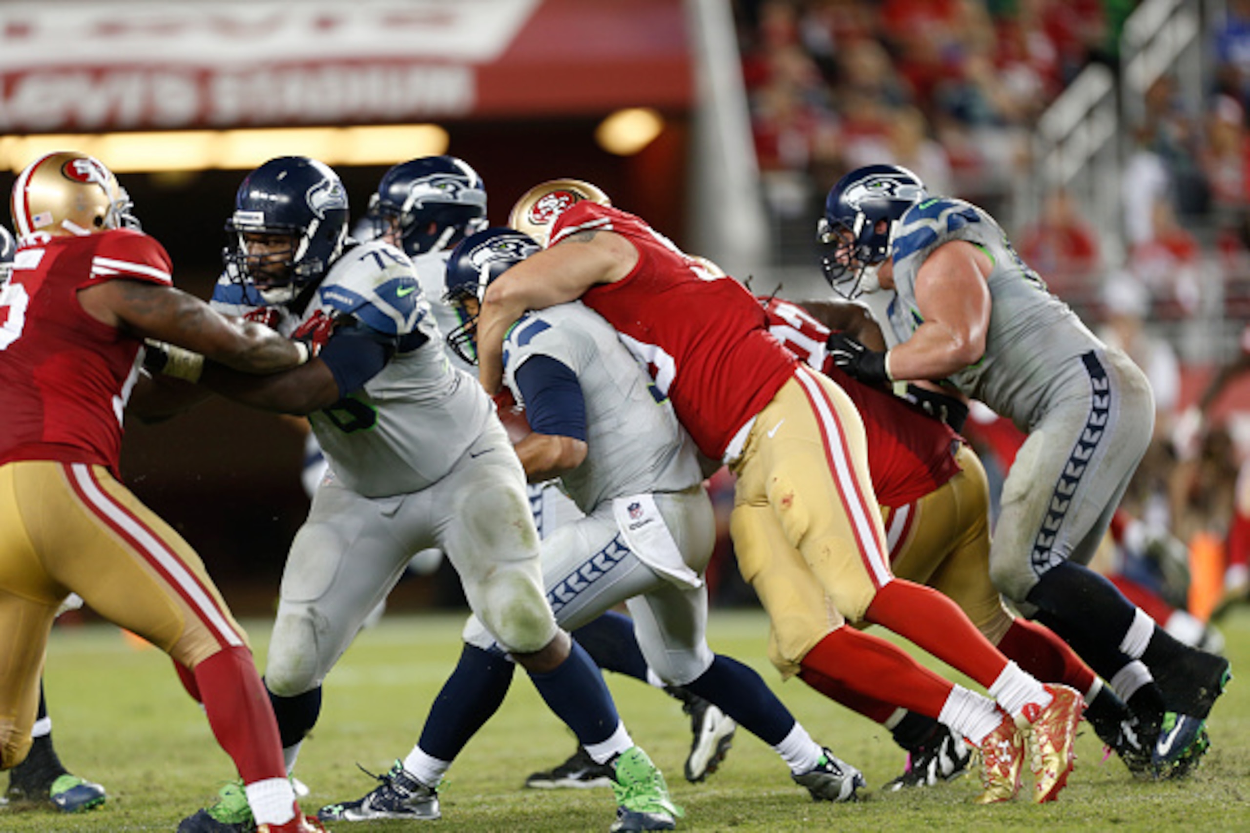 Aaron Lynch sacks Russell Wilson. Aaron Lynch sacks Russell Wilson.