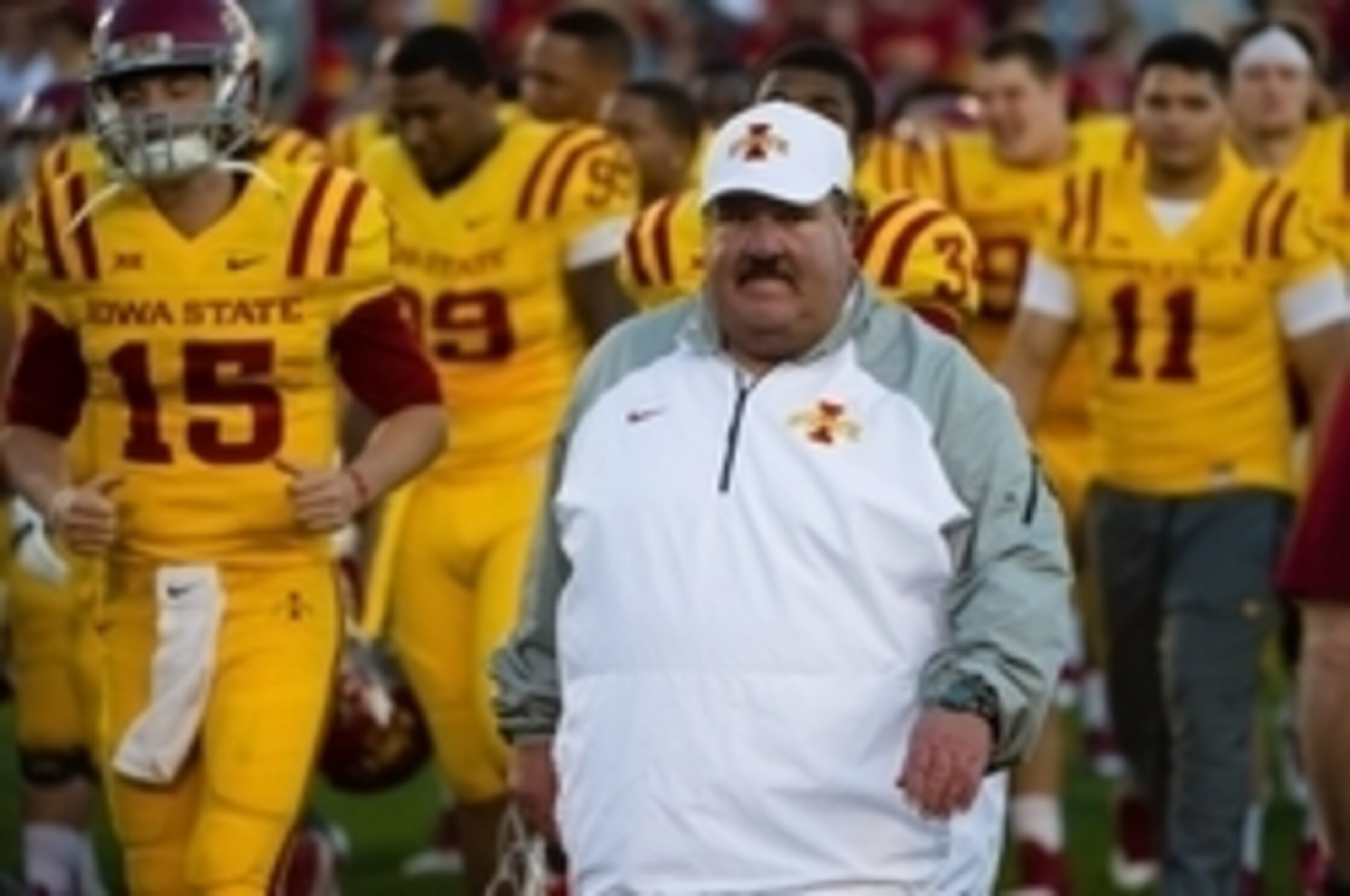 Oct 11, 2014; Ames, IA, USA; Iowa State Cyclones assistant coach Mark Mangino walks off the field with his team after a victory against the Toledo Rockets at Jack Trice Stadium. Iowa State defeated Toledo 37-30. Mandatory Credit: Steven Branscombe-USA TOD