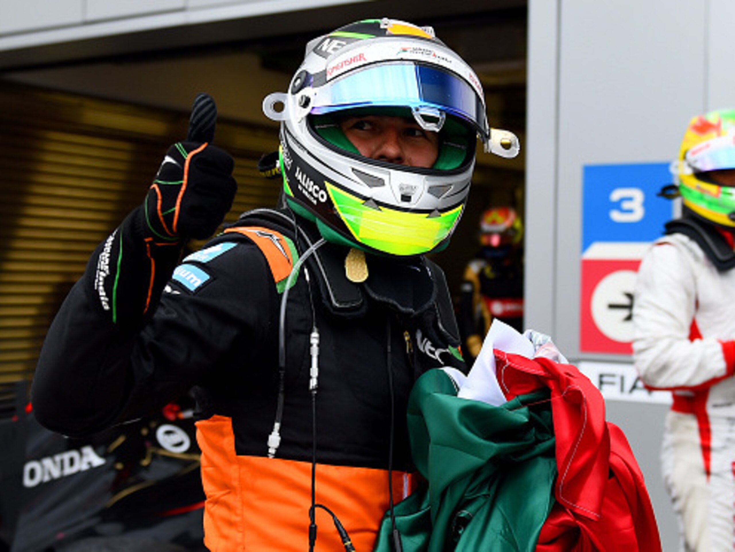 Sergio Perez celebrates his third-place finish in Russia.