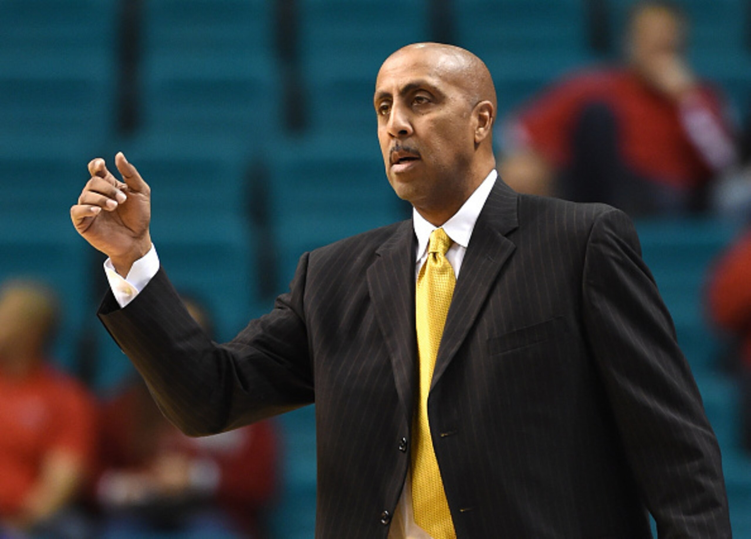 LAS VEGAS, NV - DECEMBER 20:  Head coach Lorenzo Romar of the Washington Huskies gestures to his players as they take on the Oklahoma Sooners during the 2014 MGM Grand Showcase basketball event at the MGM Grand Garden Arena on December 20, 2014 in Las Veg