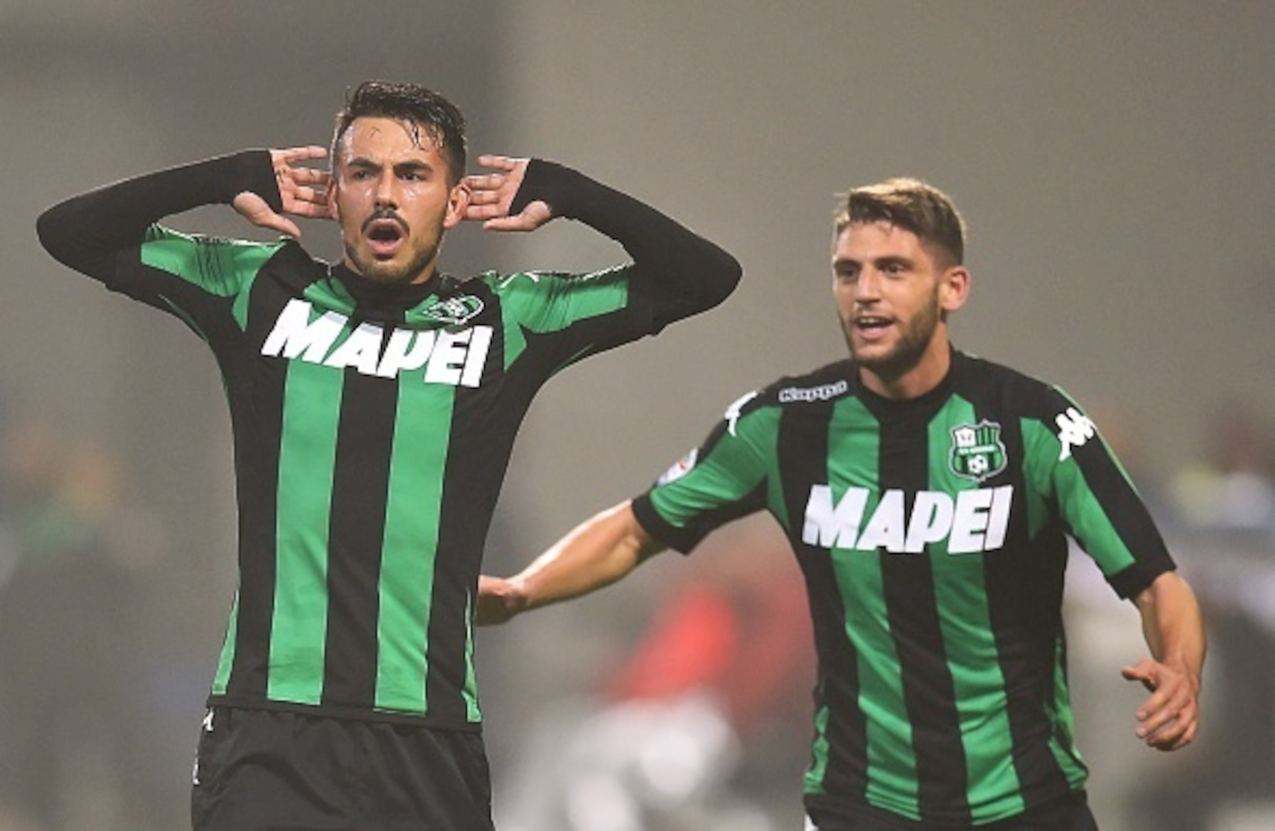 Sansone celebrates his golden free kick with Berardi.