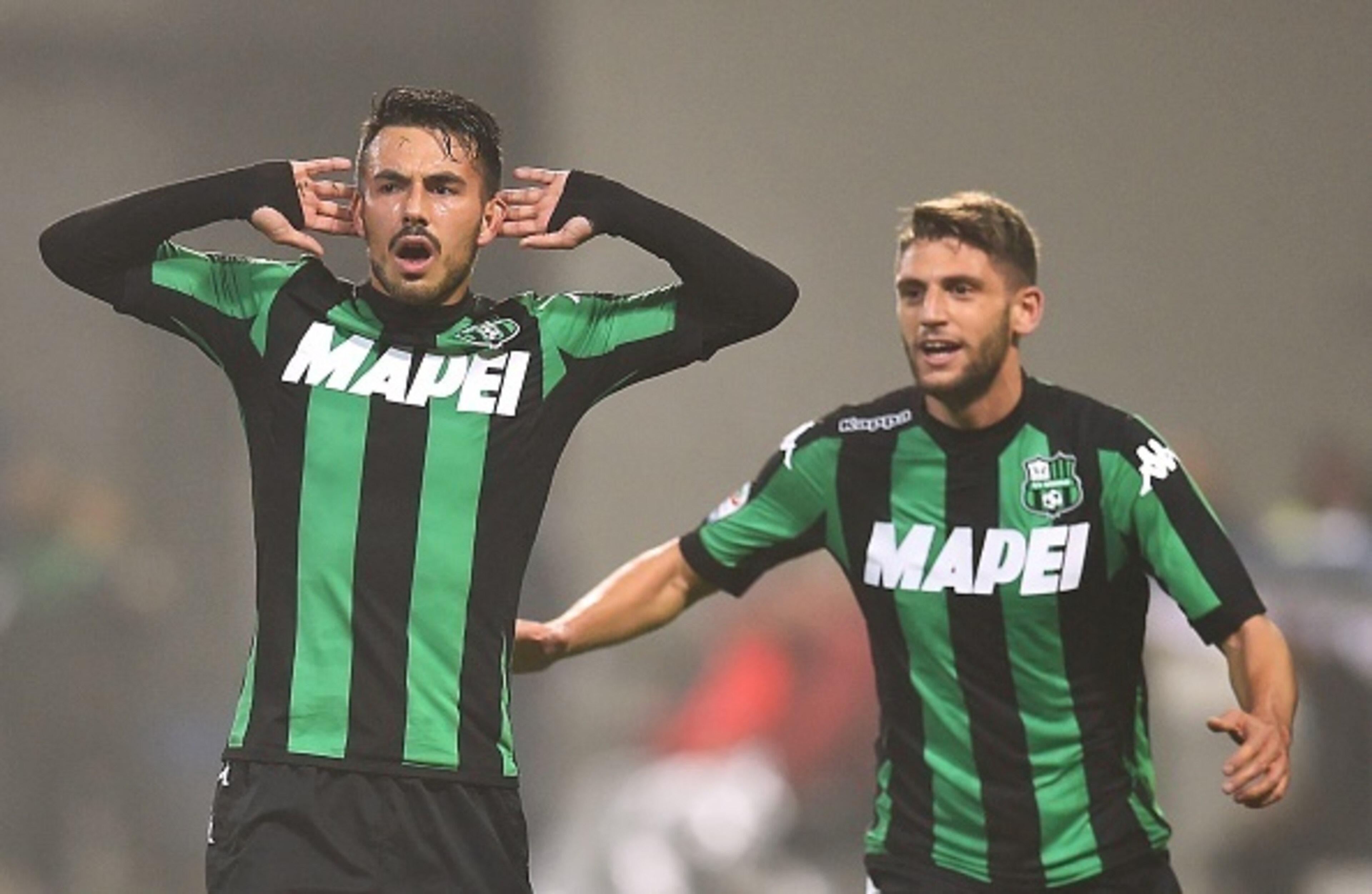 Sansone celebrates his golden free kick with Berardi. Sansone celebrates his golden free kick with Berardi.