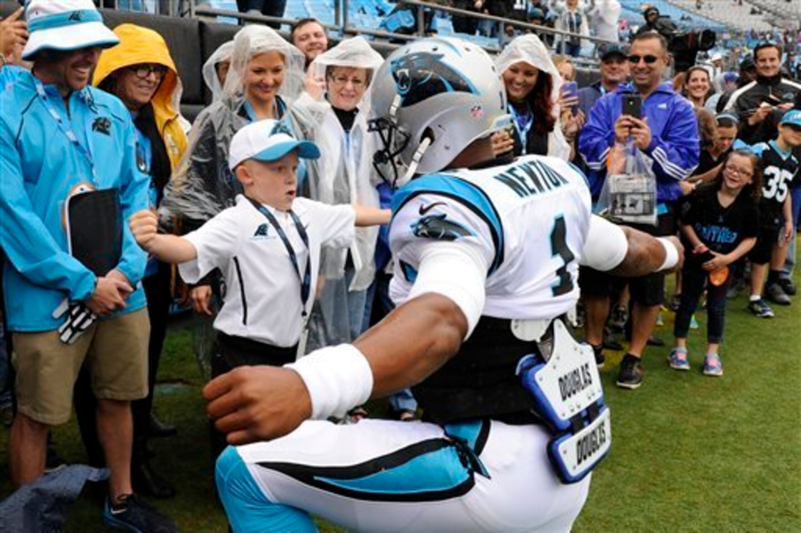 Braylon Beam and Cam Newton share the Superman celebration.