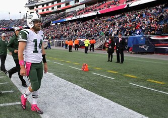 Ryan Fitzpatrick walks off the field following the Jets' loss to the Patriots.