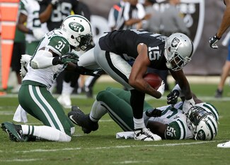 Michael Crabtree breaks two tackles to score a touchdown.