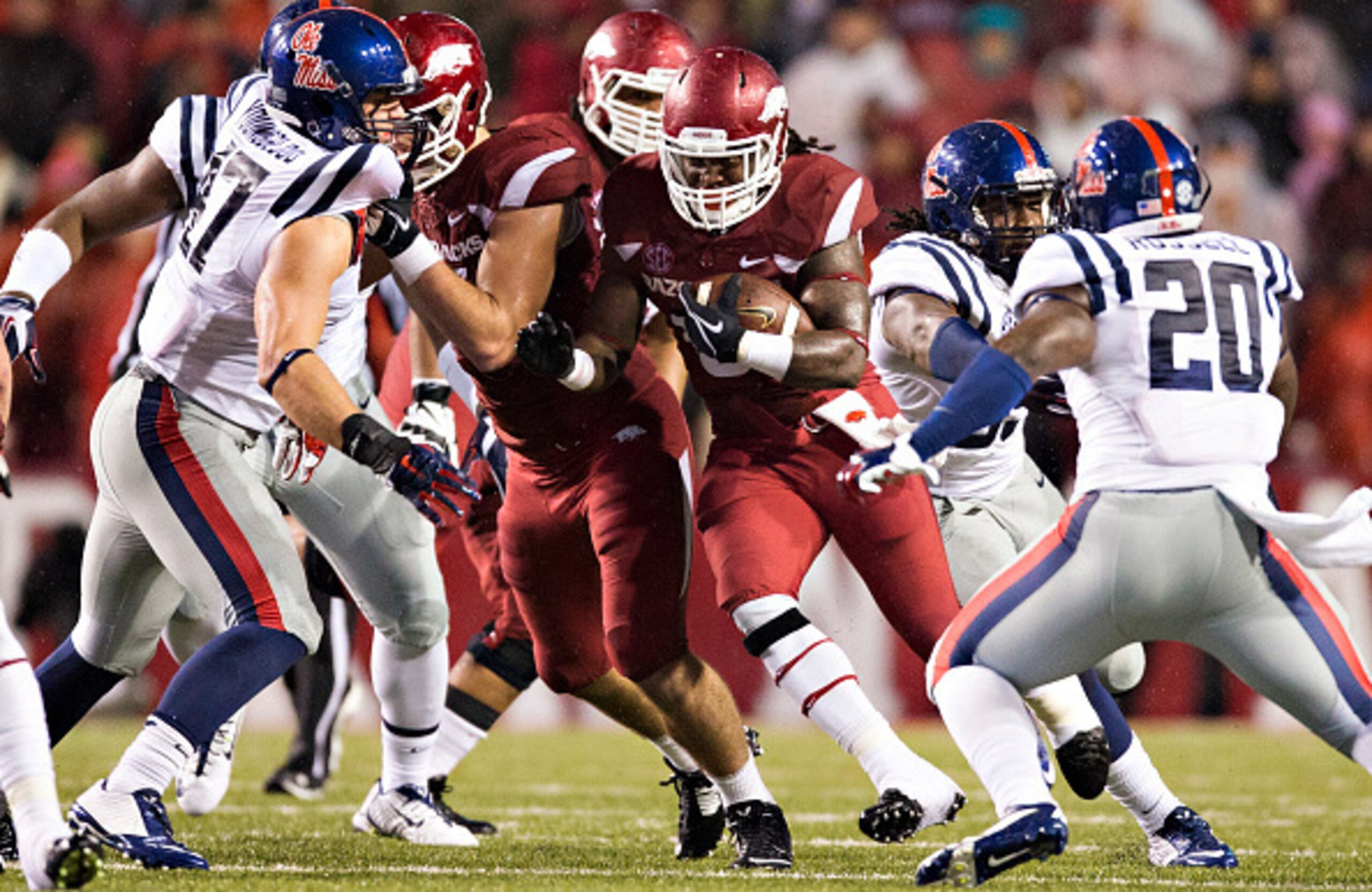 FAYETTEVILLE, AR - NOVEMBER 22:  Alex Collins #3 of the Arkansas Razorbacks runs the ball up the middle against the Ole Miss Rebels at Razorback Stadium on November 22, 2014 in Fayetteville, Arkansas.  The Razorbacks defeated the Rebels 30-0.  (Photo by W