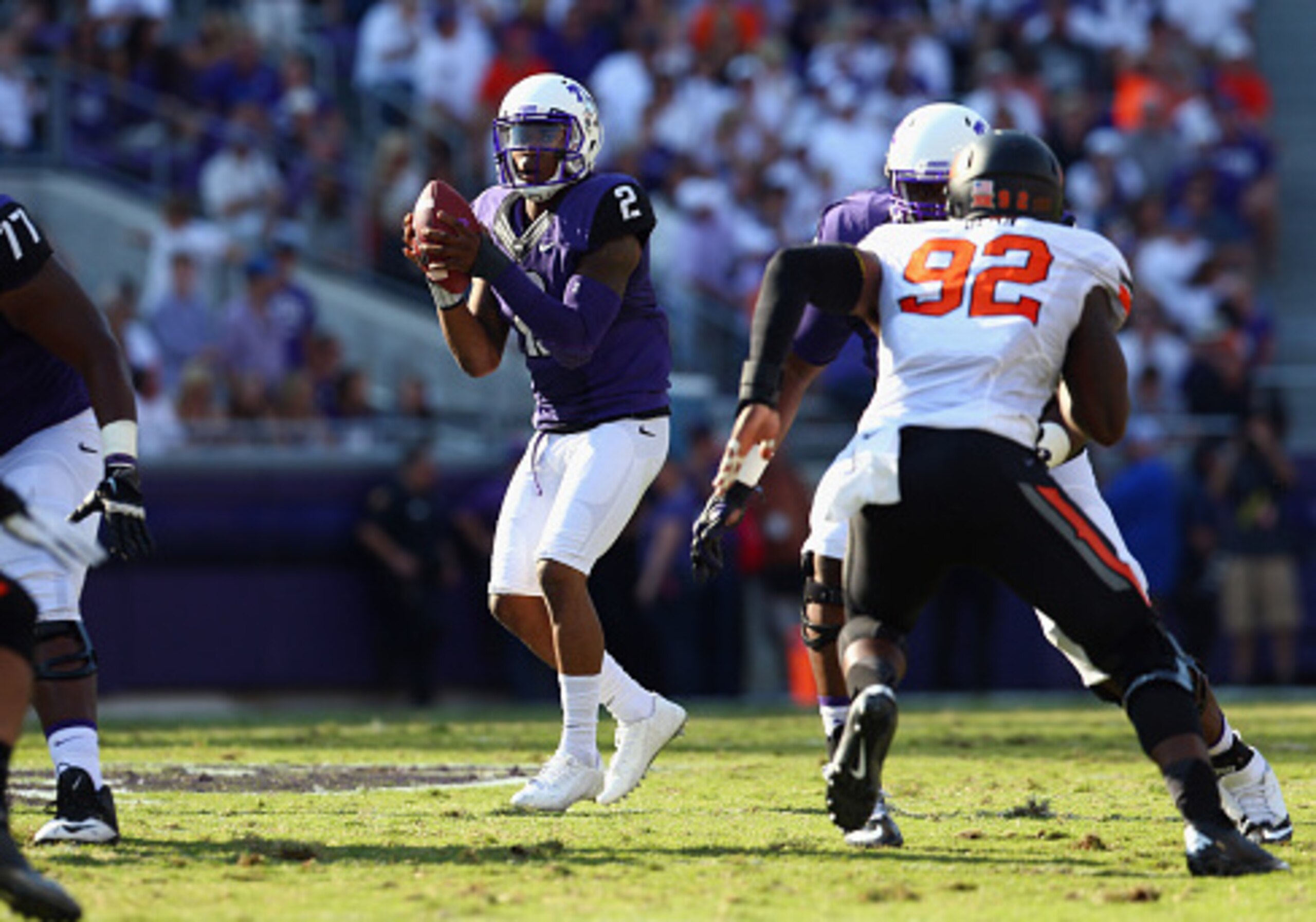 FORT WORTH, TX - OCTOBER 18:  Trevone Boykin #2 of the TCU Horned Frogs throws against the Oklahoma State Cowboys at Amon G. Carter Stadium on October 18, 2014 in Fort Worth, Texas.  (Photo by Ronald Martinez/Getty Images)