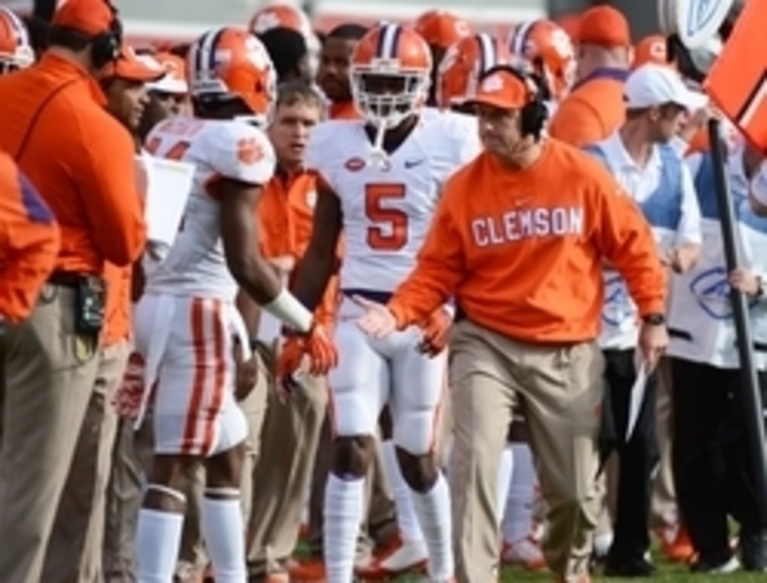 Clemson HC Dabo Swinney (right)