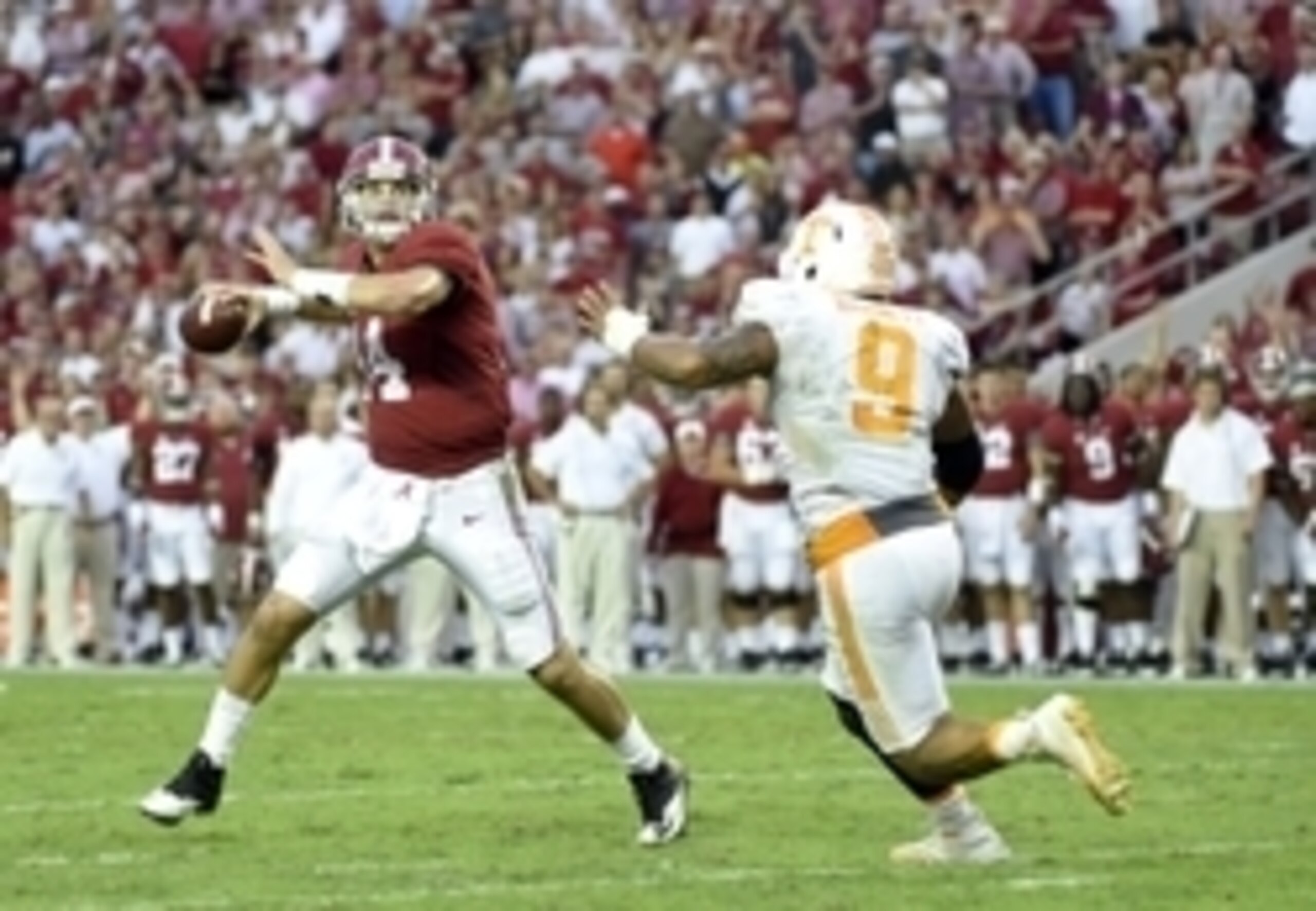 Oct 24, 2015; Tuscaloosa, AL, USA; Alabama Crimson Tide quarterback Jake Coker (14) rolls out to pass on a two point conversion against Tennessee Volunteers defensive end Derek Barnett (9) during the fourth quarter  at Bryant-Denny Stadium. Mandatory Cred