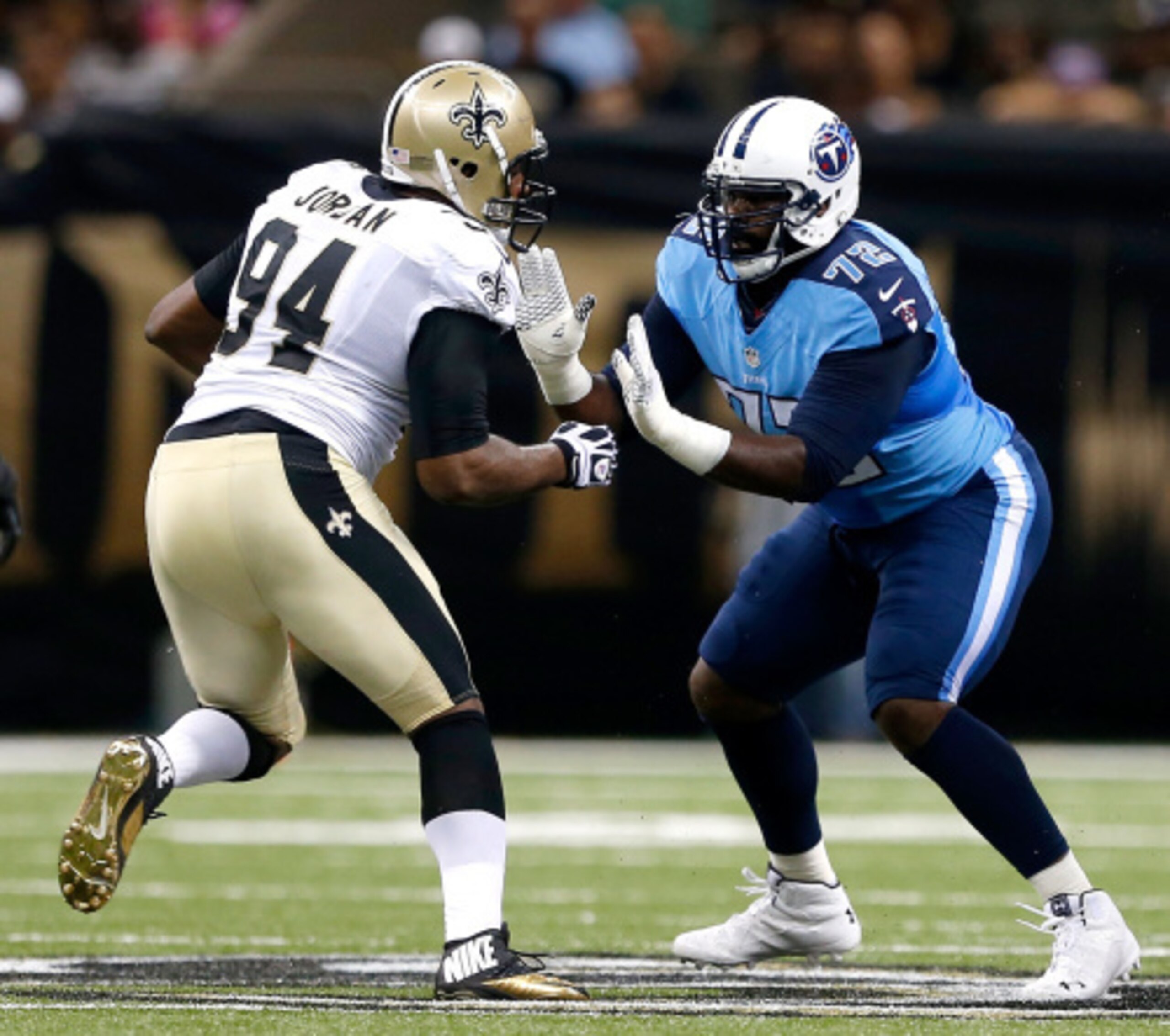 NEW ORLEANS, LA - AUGUST 15:  Michael Oher #72 of the Tennessee Titans pass protects against Cameron Jordan #94 of the New Orleans Saints a preseason game between the New Orleans Saints and the Tennessee Titans at the Mercedes-Benz Superdome on August 15,