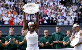 Serena Williams holds up the Venus Rosewater Dish after winning the 2015 Wimbledon Championships.
