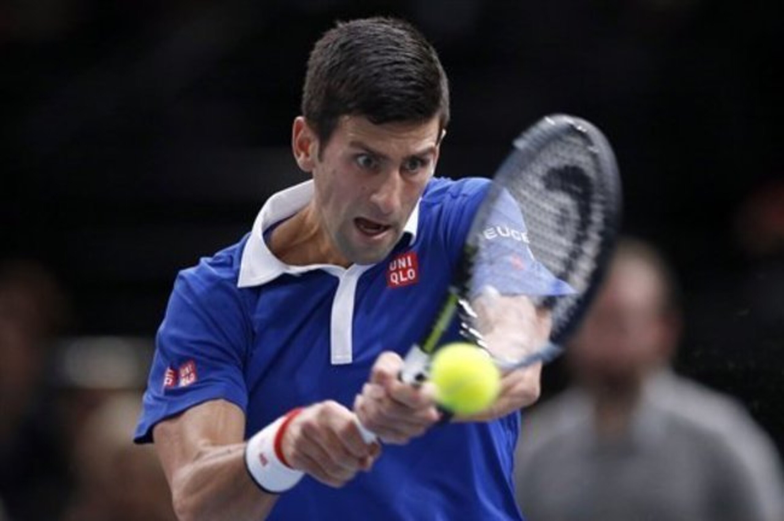 Novak Djokovic hits a backhand during a match at the Paris Masters.