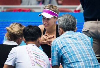 Eugenie Bouchard during a medical timeout before retiring from her match at the China Open.