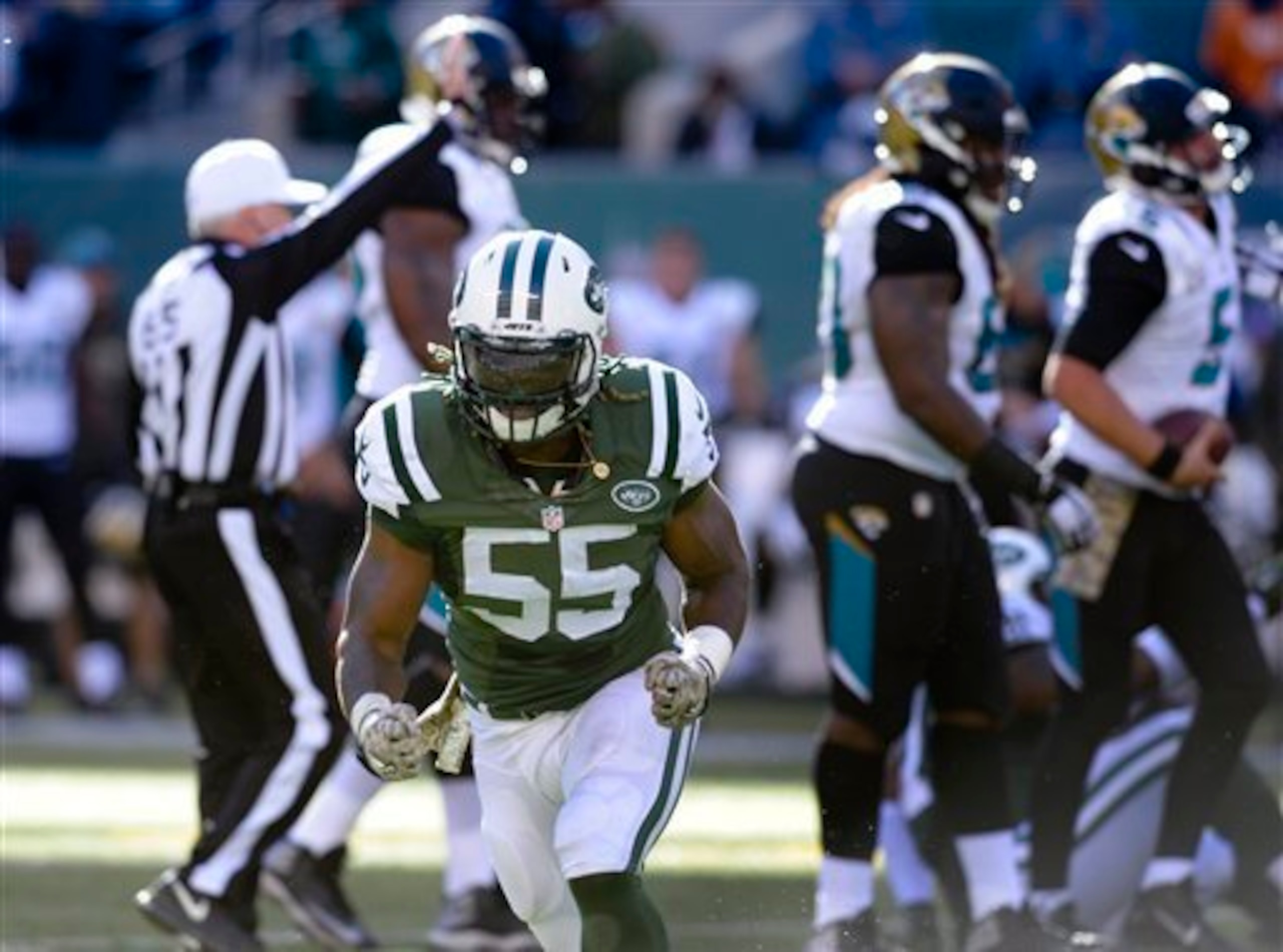 Lorenzo Mauldin (55) celebrates a sack.