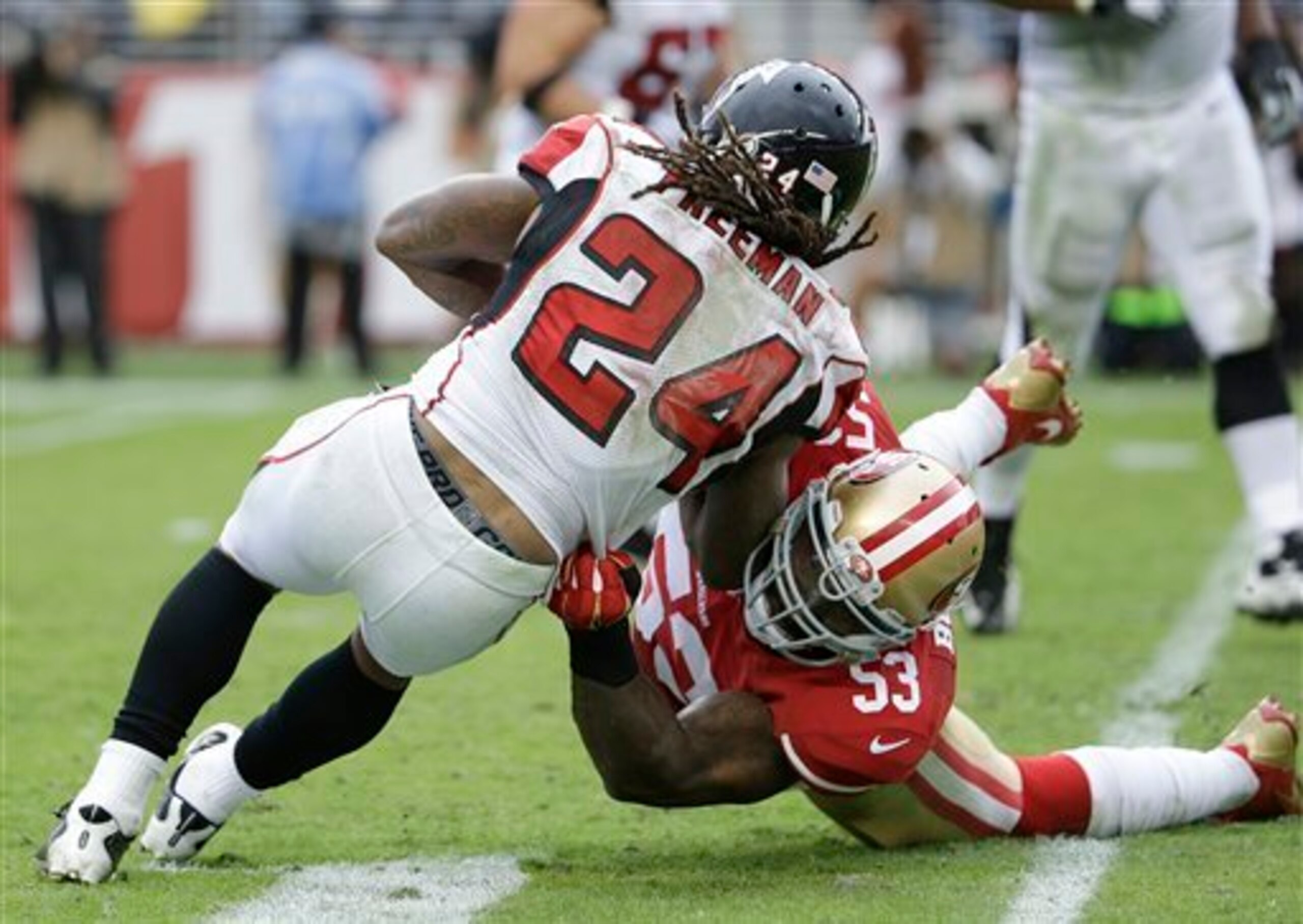 Linebacker NaVorro Bowman (53) was an integral part in holding Falcons running back Devonta Freeman (24) to a minimal Week 9 effort.