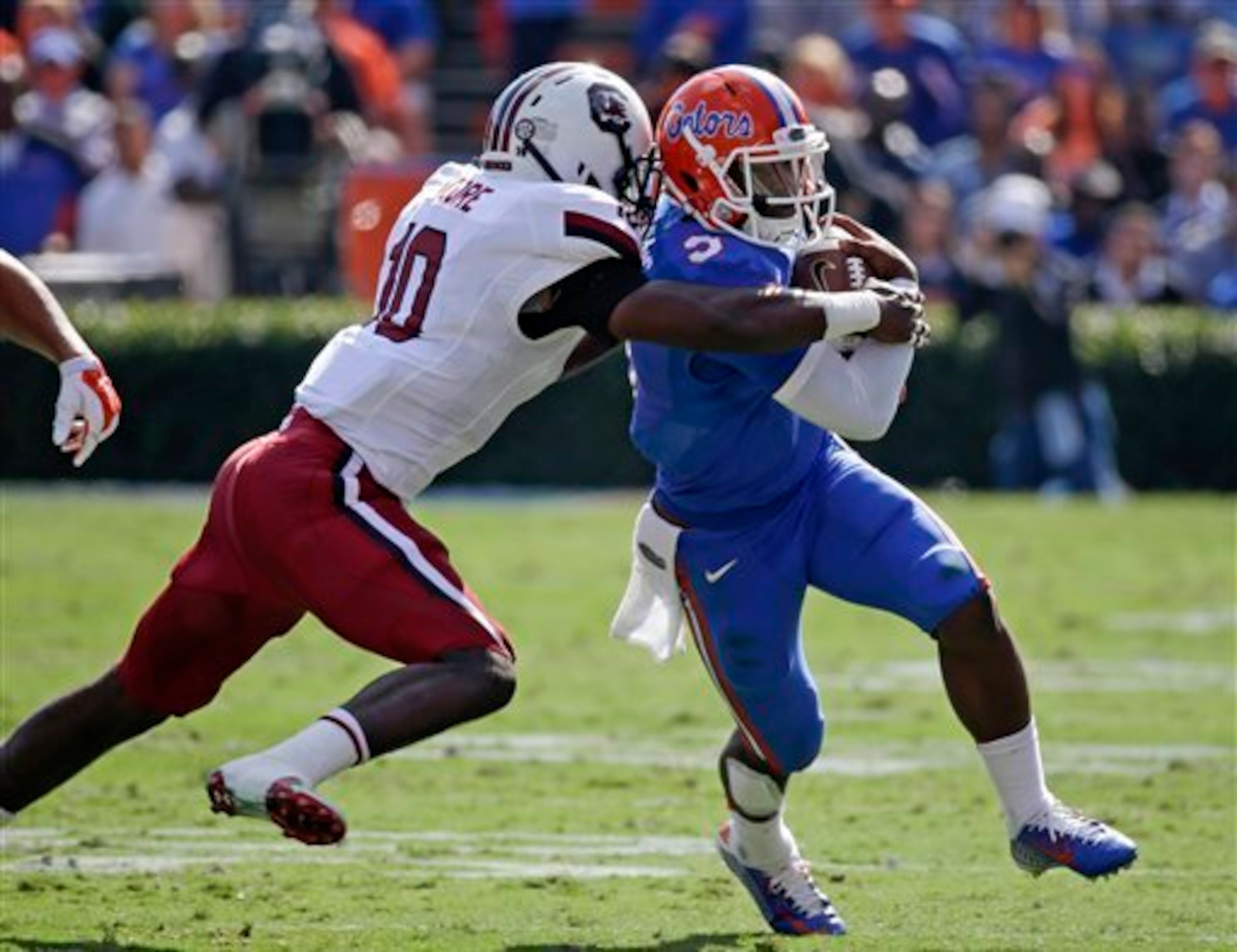 South Carolina LB Skai Moore and Florida QB Treon Harris