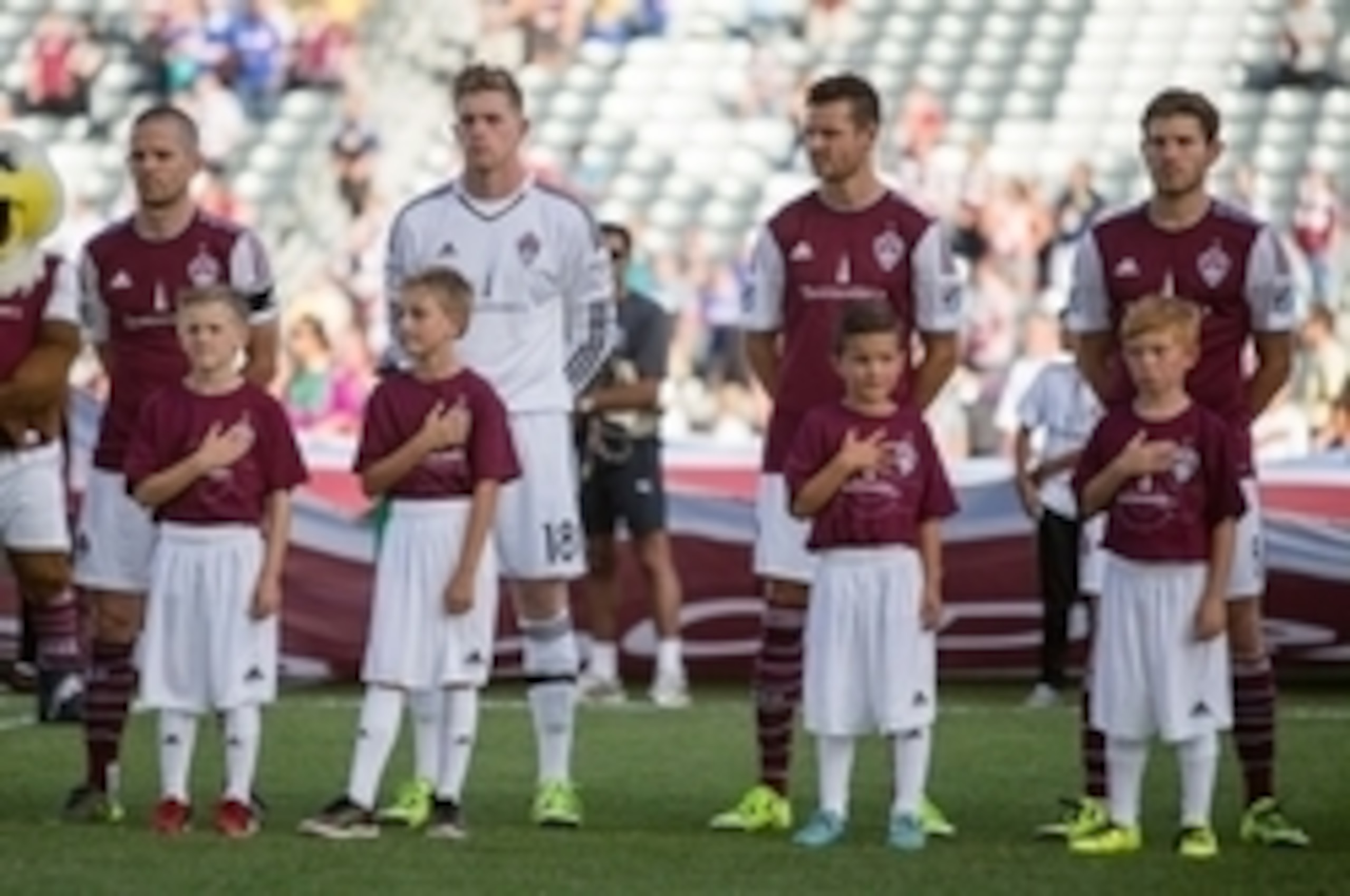 Oct 10, 2015; Commerce City, CO, USA; (from left to right); Colorado Rapids midfielder Sam Cronin (6) and goalkeeper Zac MacMath (18) and forward Luis Solignac (21) and midfielder Dillon Powers (8) during player introductions prior to the match against th