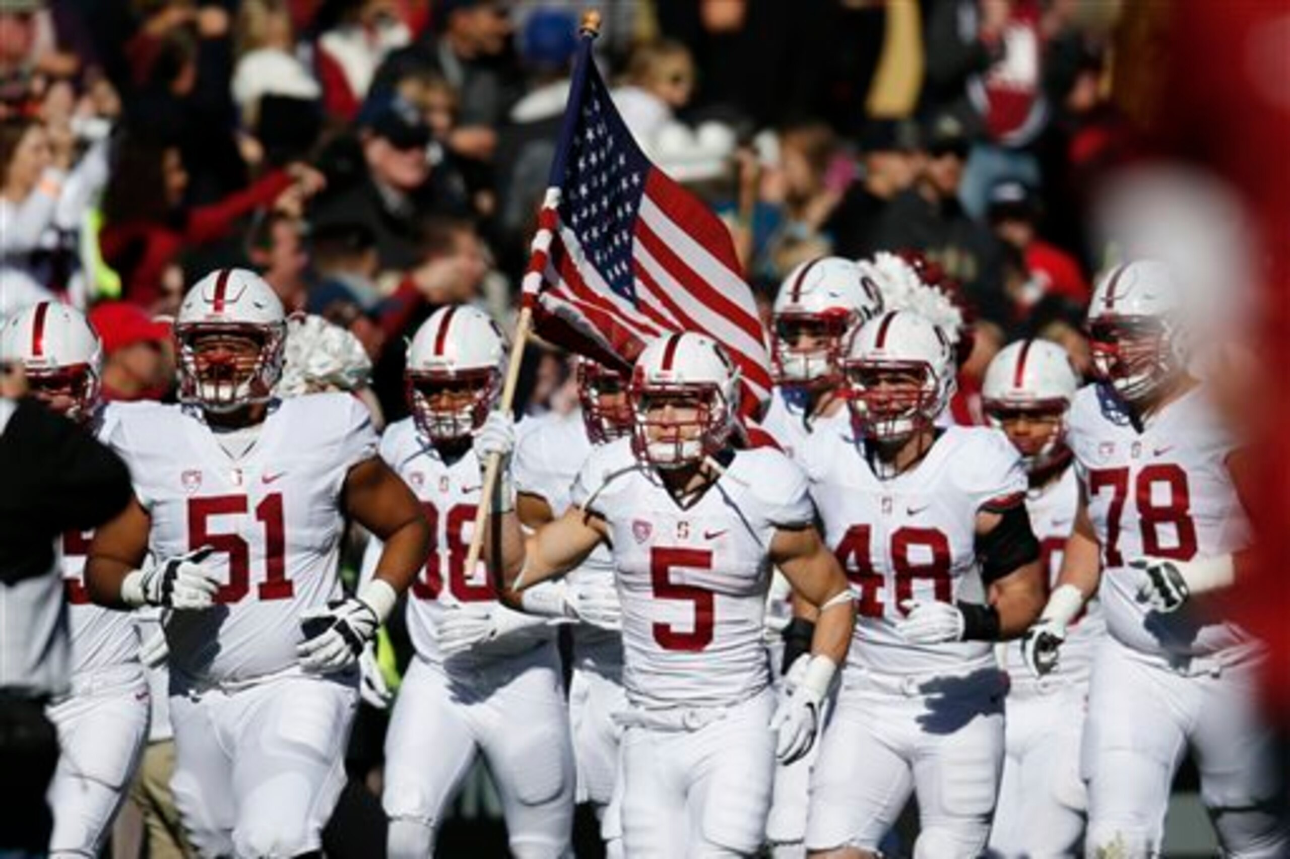 Stanford RB Christian McCaffrey (center)