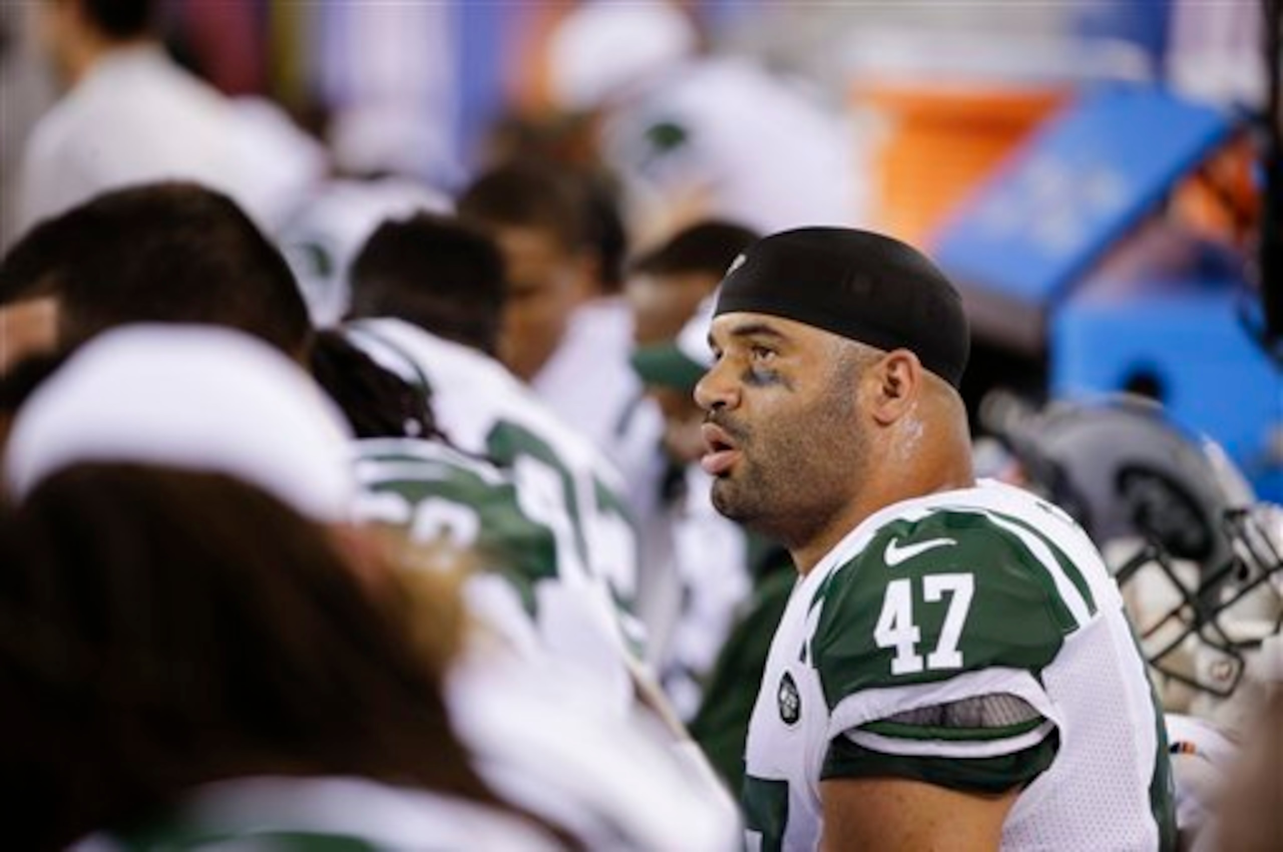 Kellen Davis sits on the bench of a Jets game.