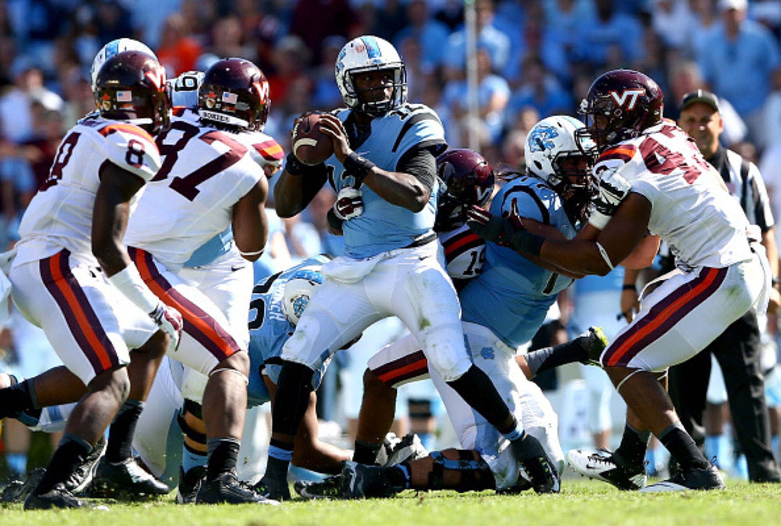 North Carolina QB Marquise Williams (center)