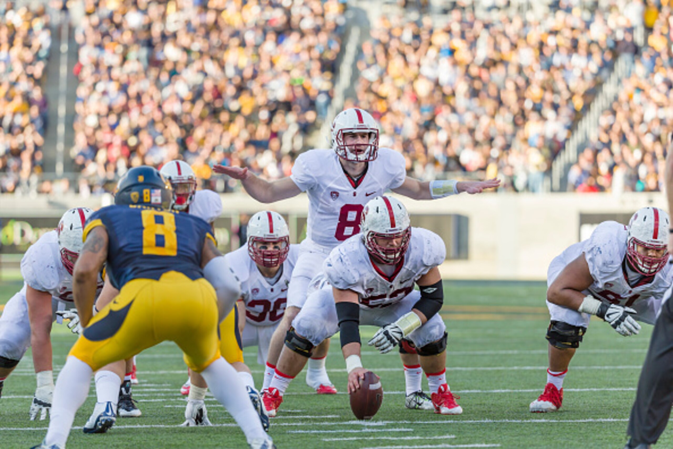 Stanford QB Kevin Hogan (center)