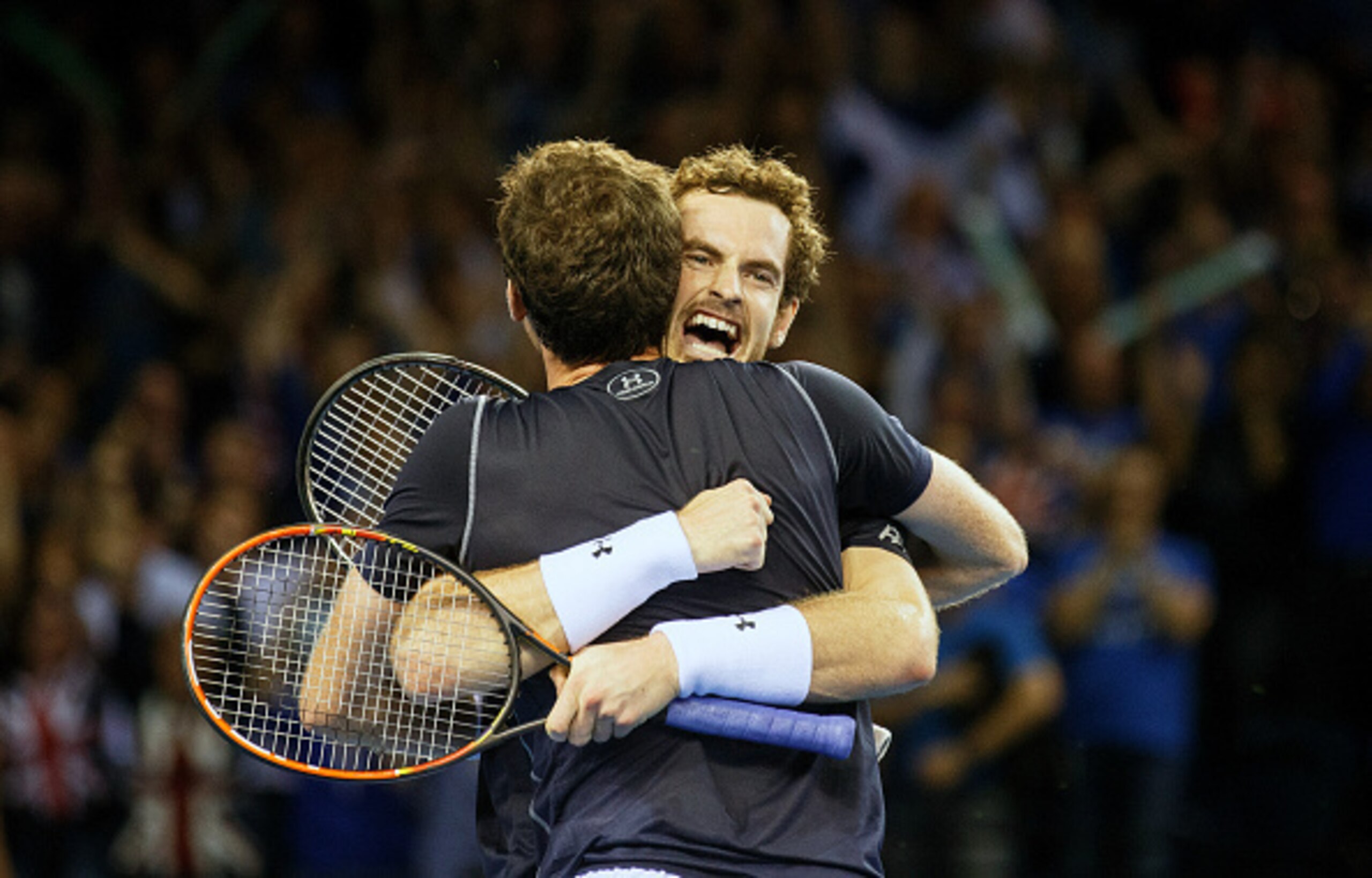 Andy Murray and brother Jamie Murray celebrate their doubles win during the Davis Cup semifinals.