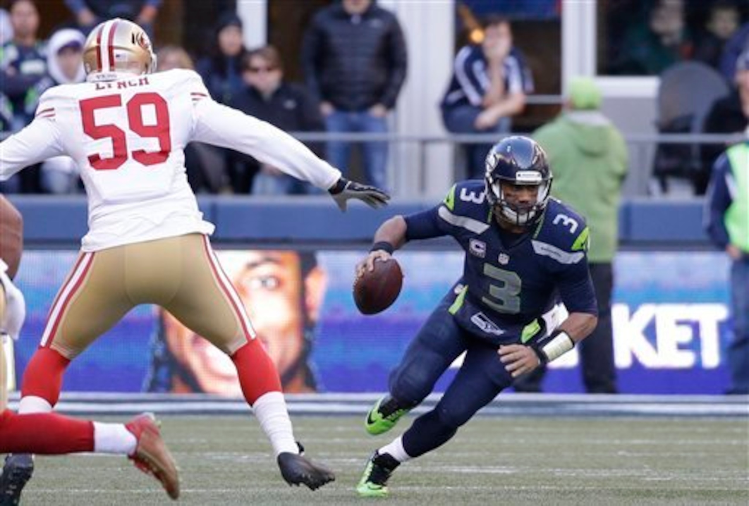Can linebacker Aaron Lynch (left) find success rushing quarterback Russell Wilson (right) in Week 11?