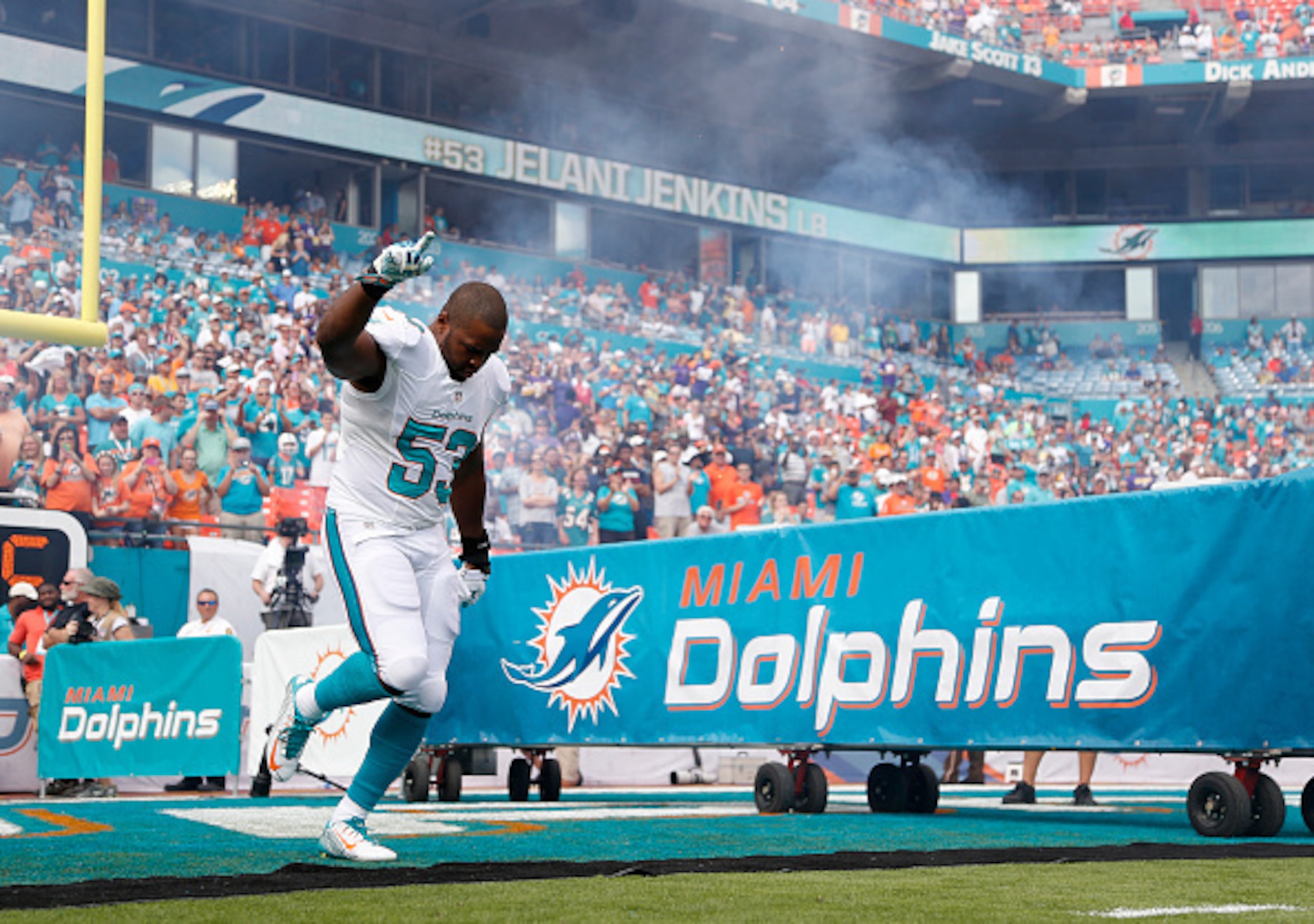 MIAMI GARDENS, FL - DECEMBER 21:  Outside linebacker Jelani Jenkins #53 of the Miami Dolphins runs onto the field before the Dolphins met the Minnesota Vikings in a game at Sun Life Stadium on December 21, 2014 in Miami Gardens, Florida.  (Photo by Rob Fo