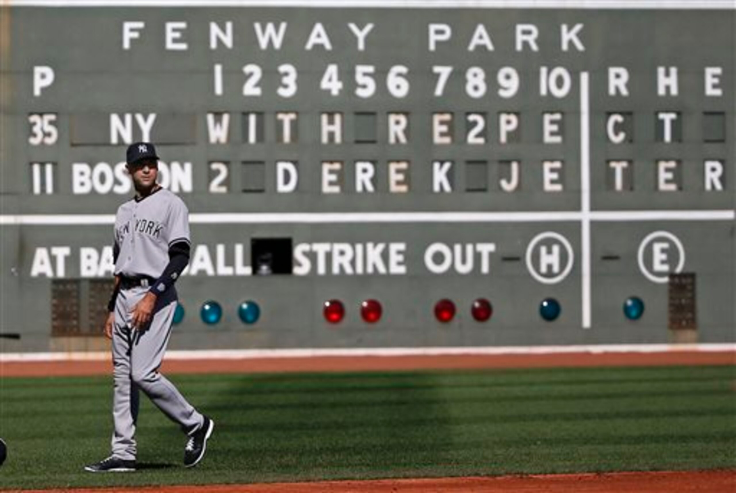 Those letters and numbers at the Fenway Park scoreboards don't go up on their own