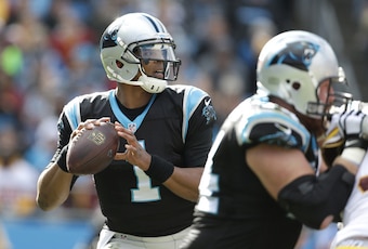 Cam Newton dropping back in the pocket.
