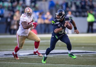 Ahmad Brooks in pursuit of Russell Wilson.