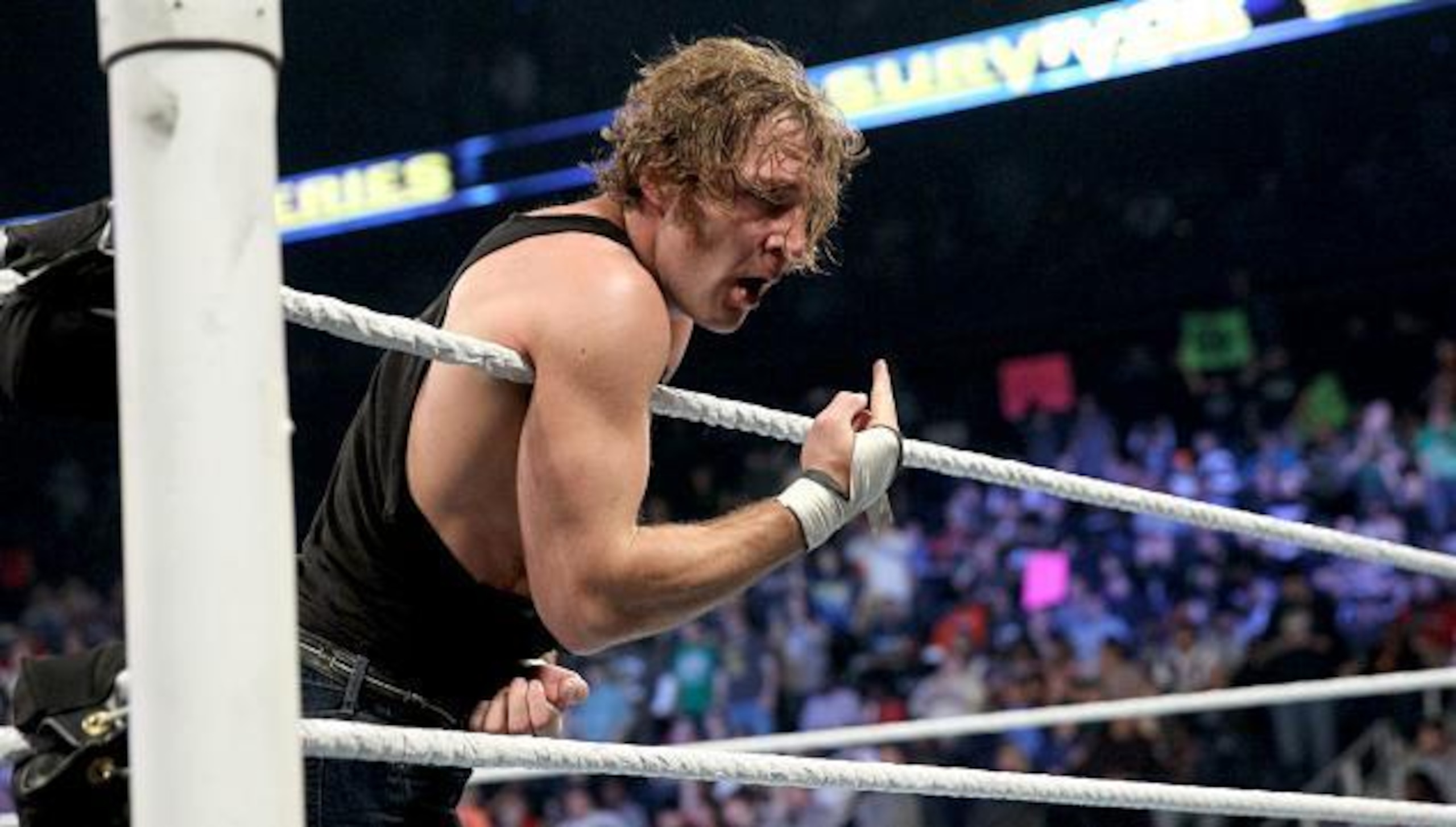 Dean Ambrose celebrates after defeating Kevin Owens to advance to the finals of the WWE World Heavyweight Championship tournament.