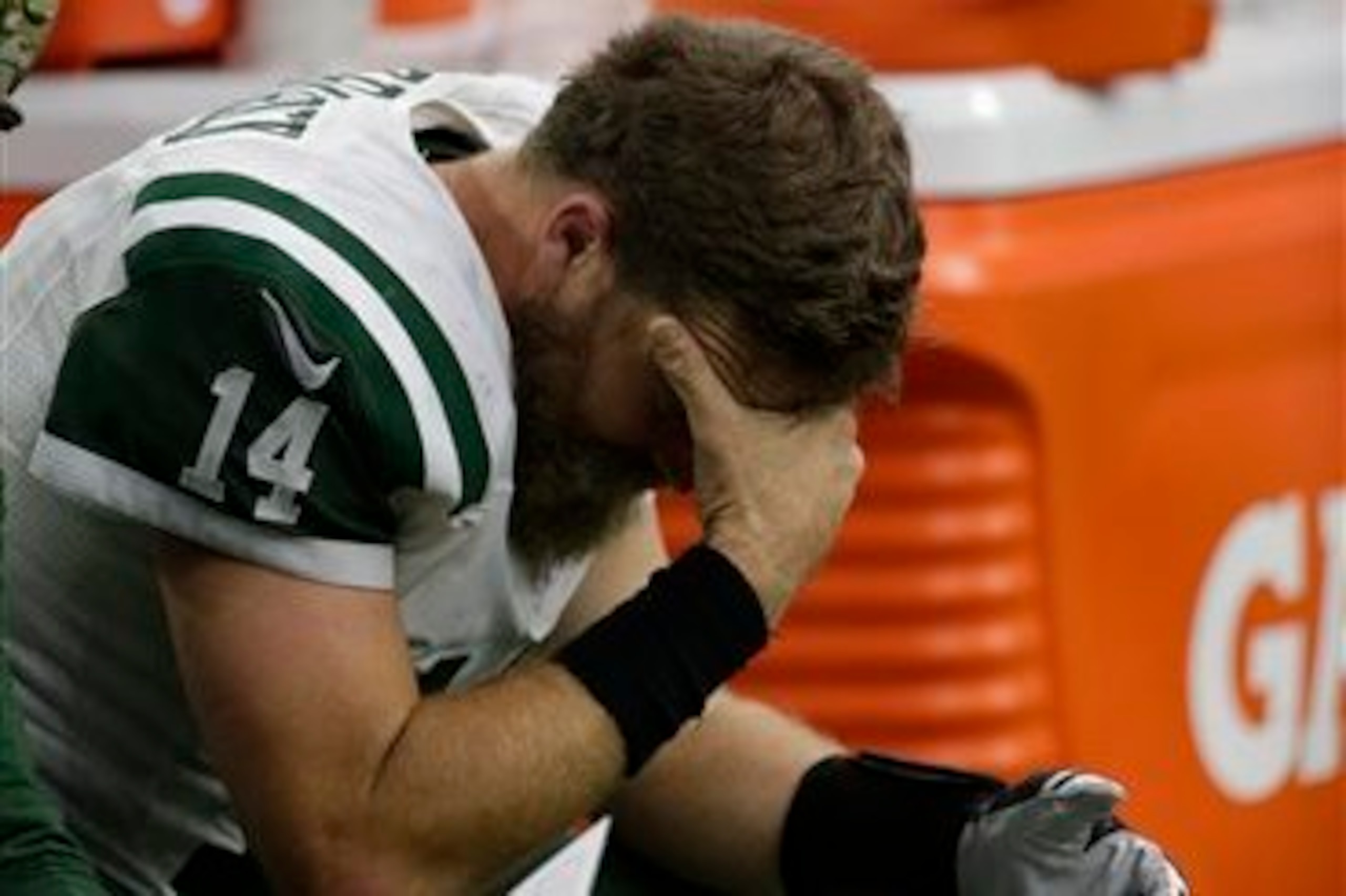Ryan Fitzpatrick sits on the sideline after the Jets lost their fifth game of the season.