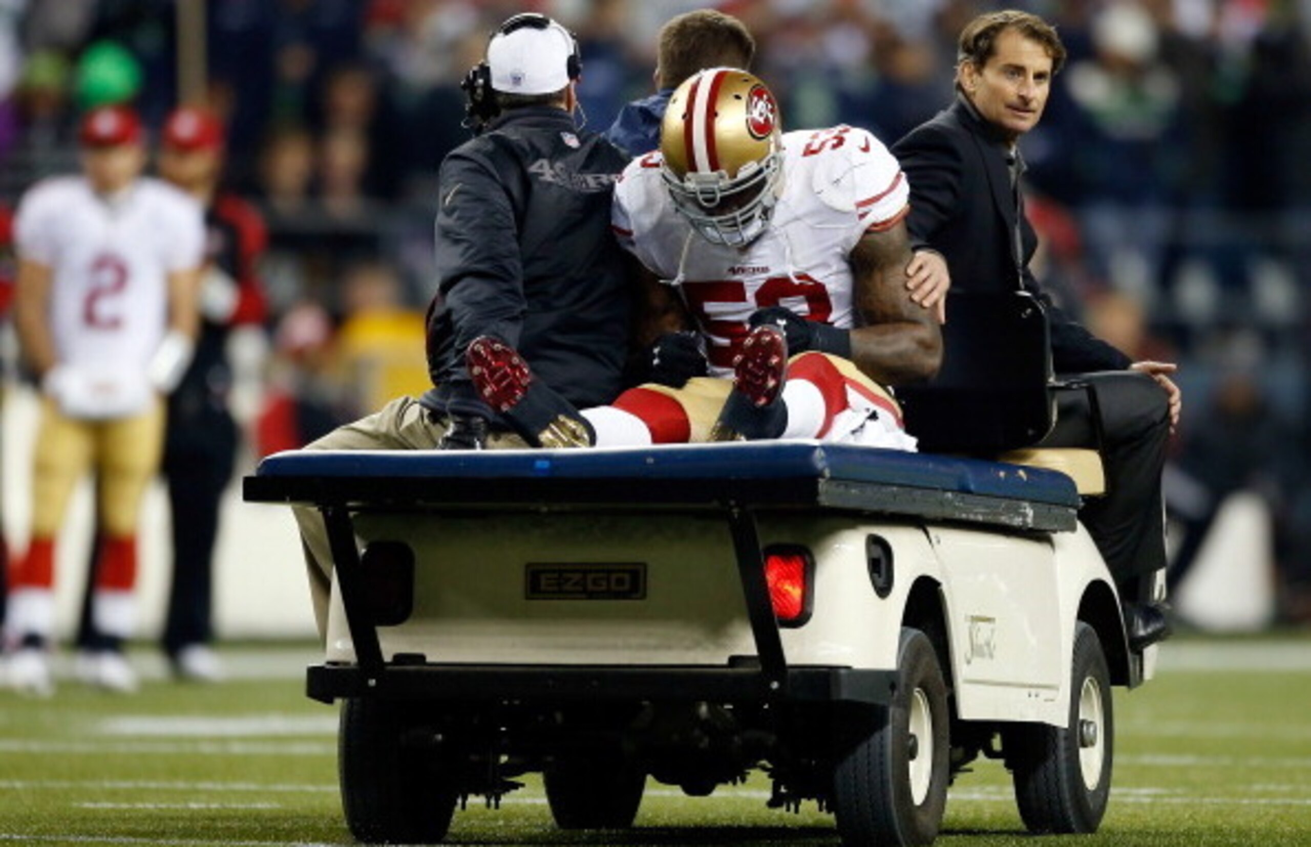 SEATTLE, WA - JANUARY 19:  Linebacker NaVorro Bowman #53 of the San Francisco 49ers is carted off the field in the fourth quarter against the Seattle Seahawks during the 2014 NFC Championship at CenturyLink Field on January 19, 2014 in Seattle, Washington