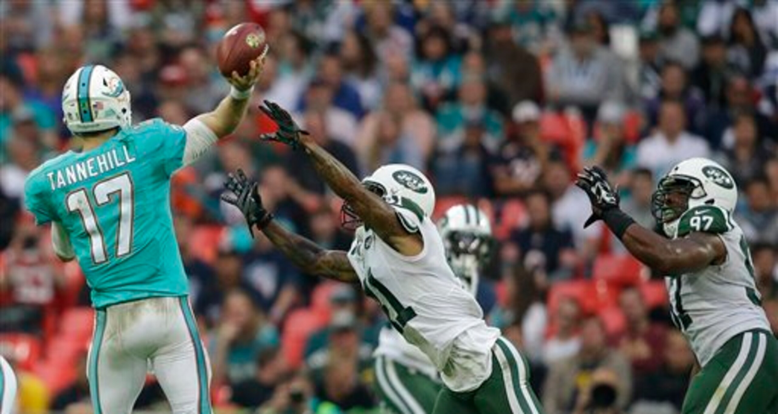 Ryan Tannehill gets rid of a pass just in time against the Jets.
