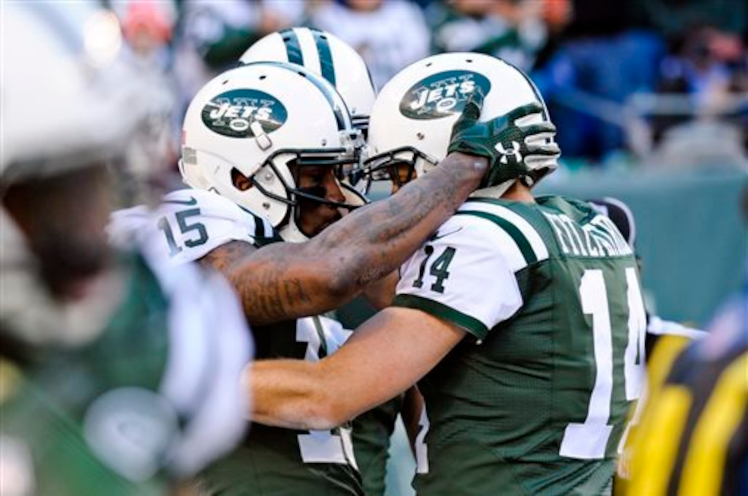 Ryan Fitzpatrick (14) celebrates a touchdown with Brandon Marshall (15). Ryan Fitzpatrick (14) celebrates a touchdown with Brandon Marshall (15).