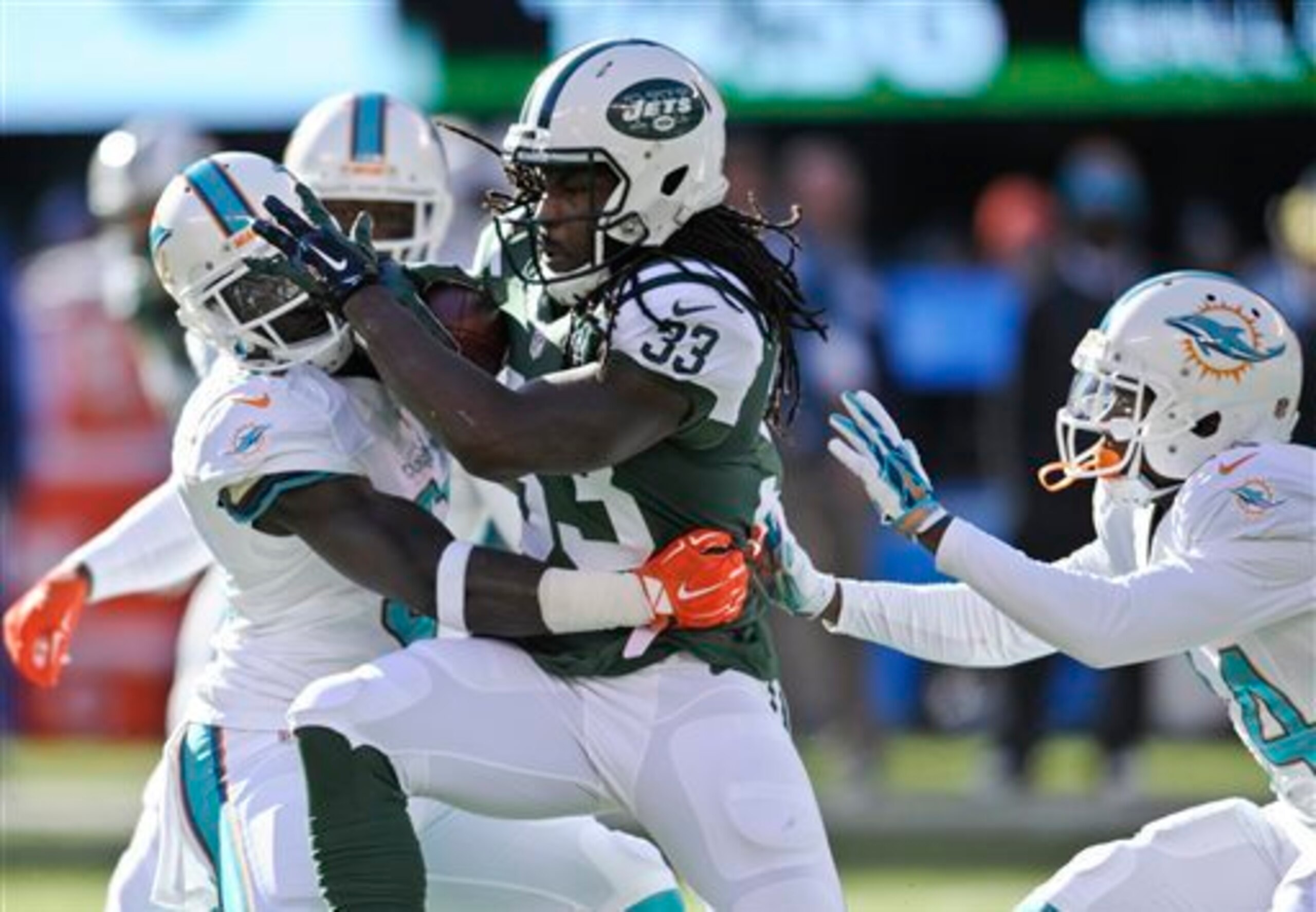 Chris Ivory fights for extra yards against the Dolphins. Chris Ivory fights for extra yards against the Dolphins.