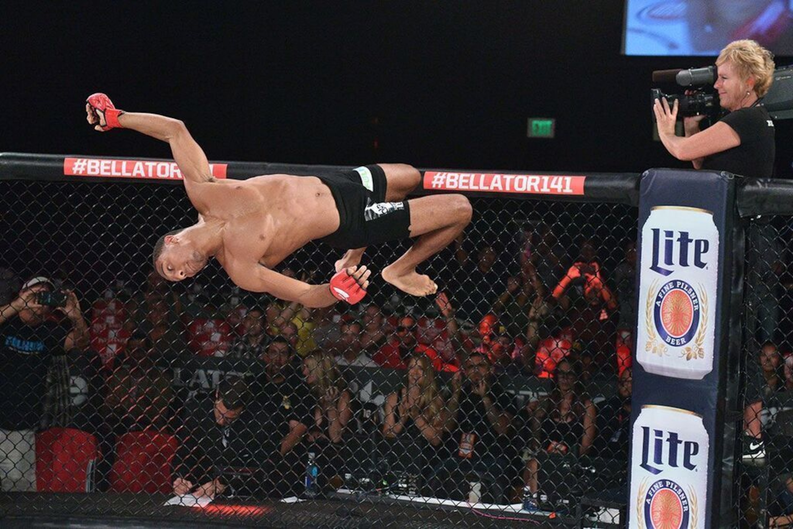 A.J. McKee flips off the cage.