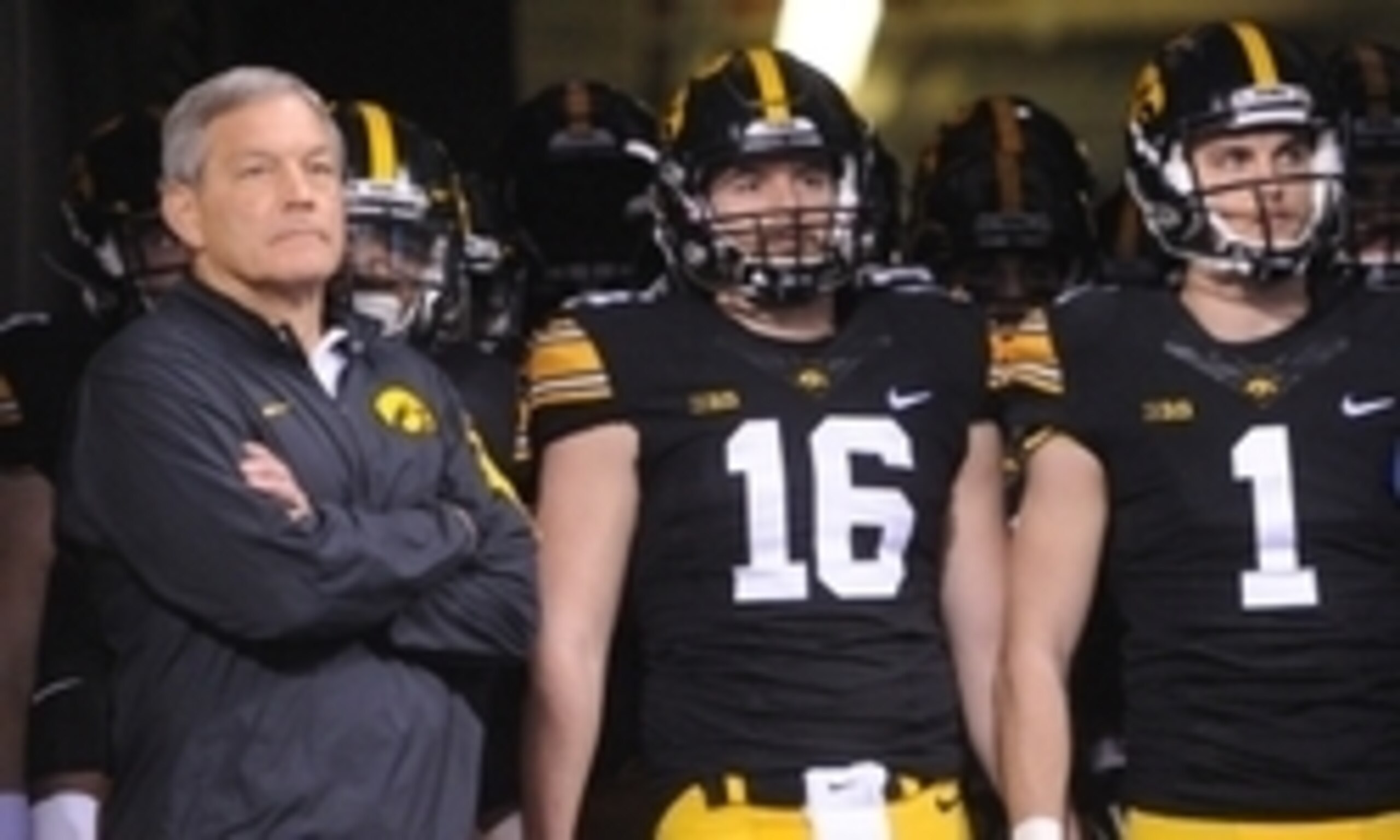 Iowa head coach Kirk Ferentz (left)