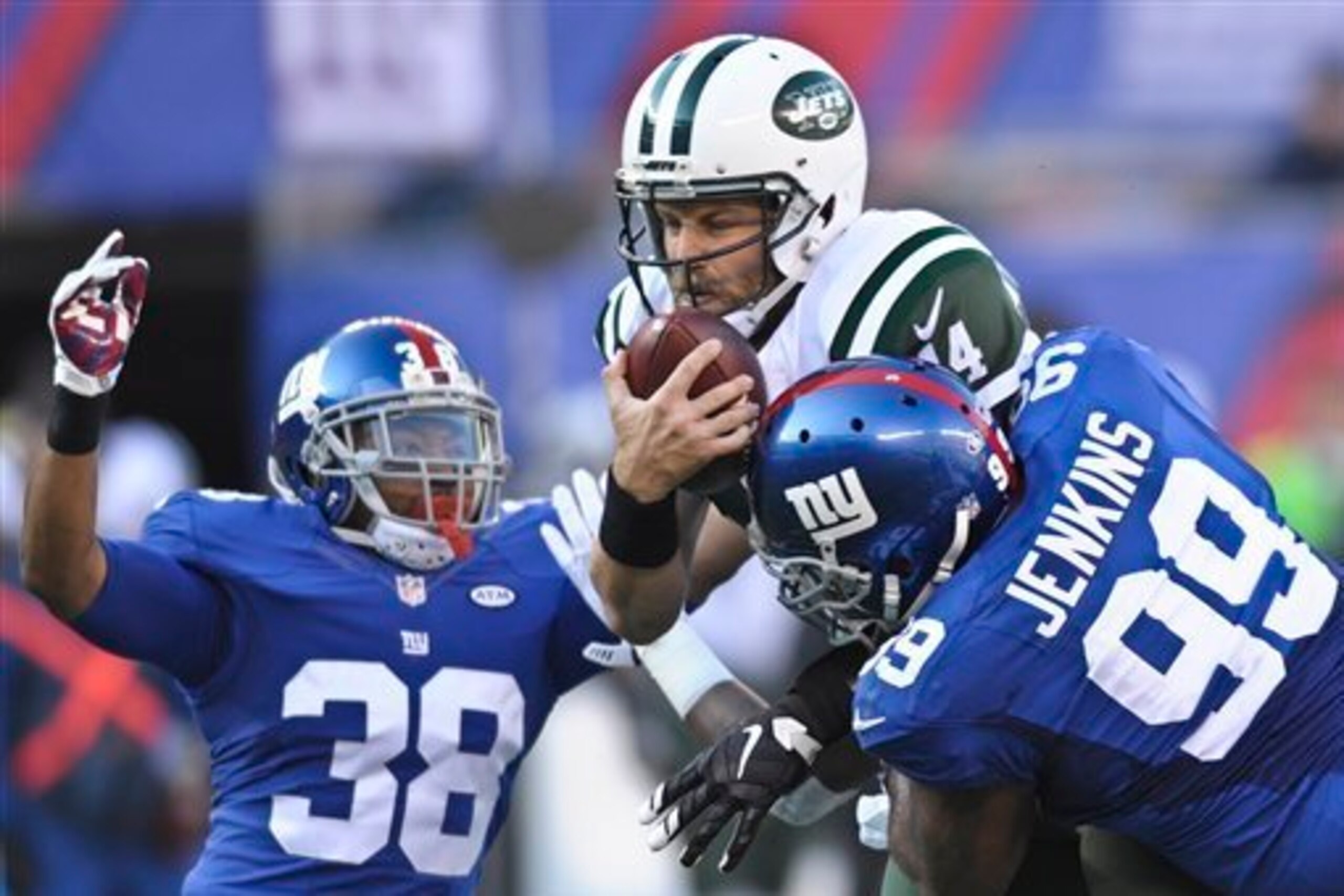 Ryan Fitzpatrick fights for a first down against the Giants.