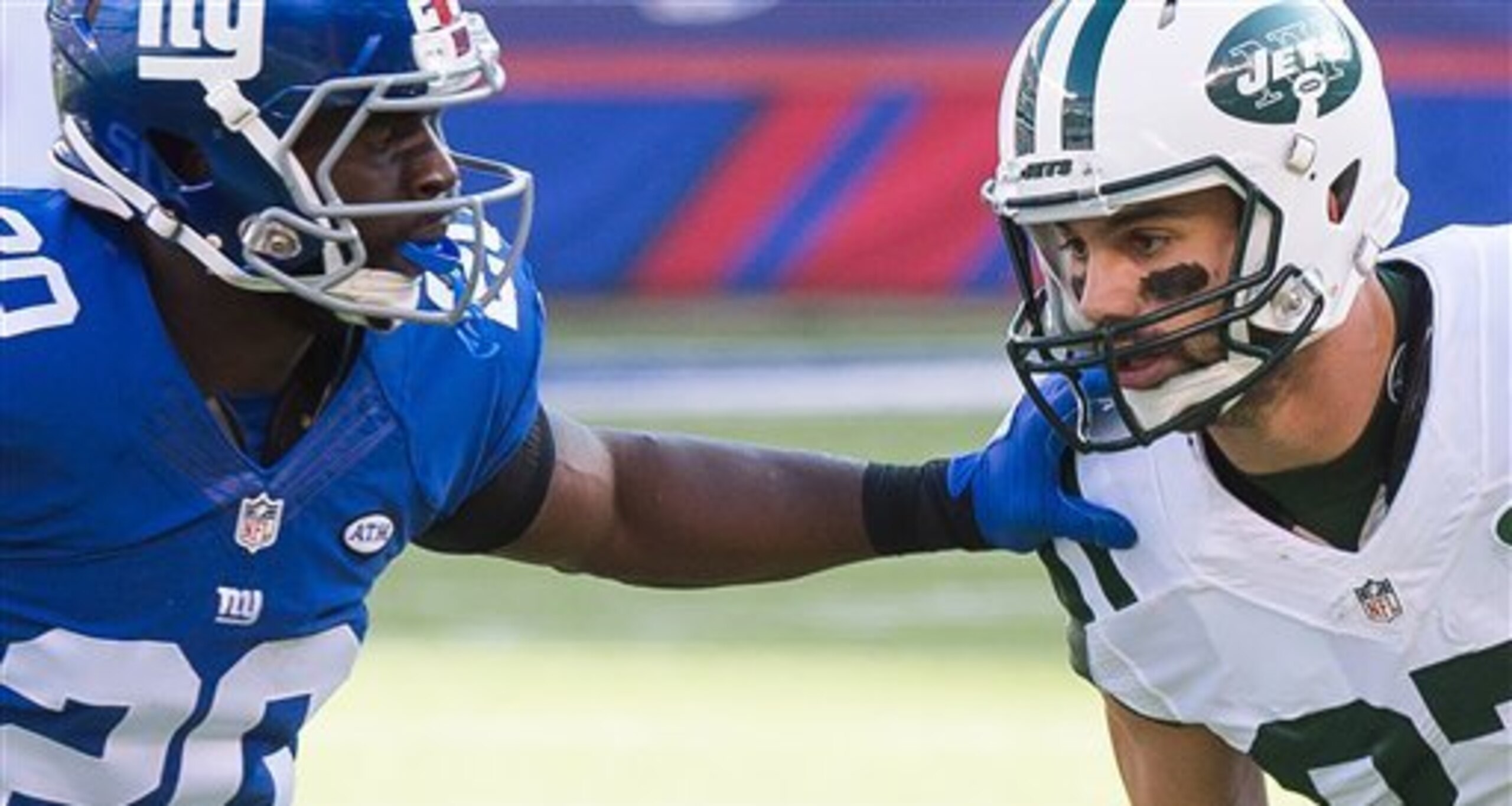 Prince Amukamara jams Eric Decker at the line.