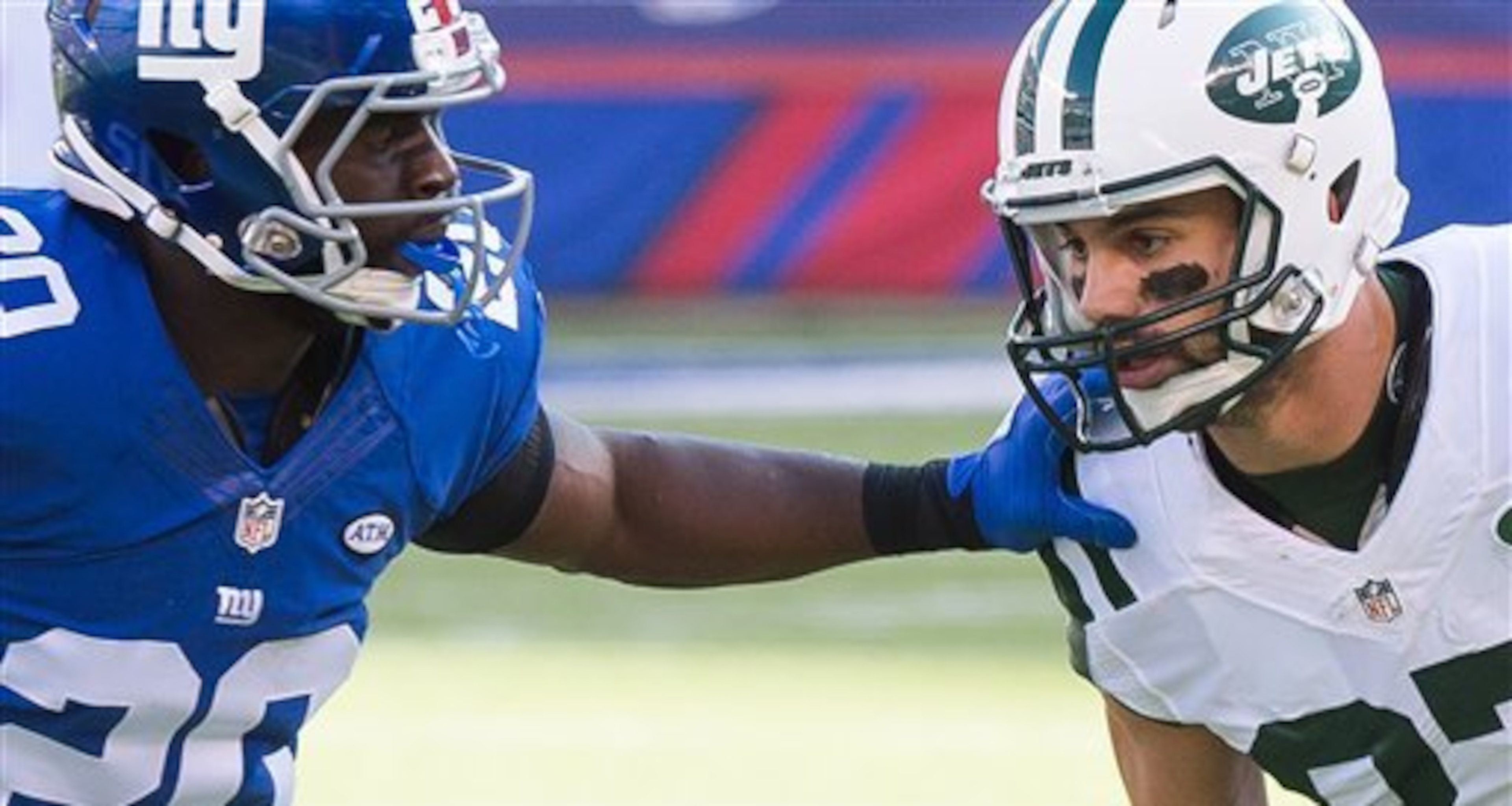 Prince Amukamara jams Eric Decker at the line.