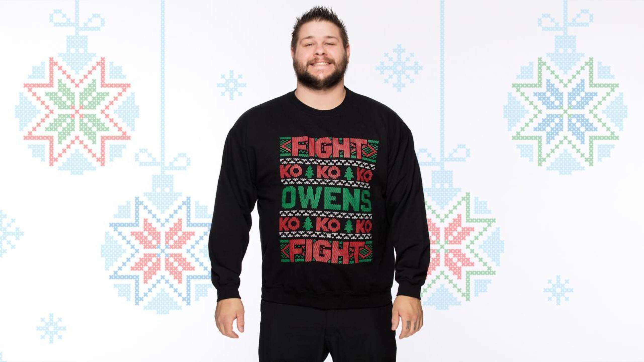 Kevin Owens sports an ugly sweater.