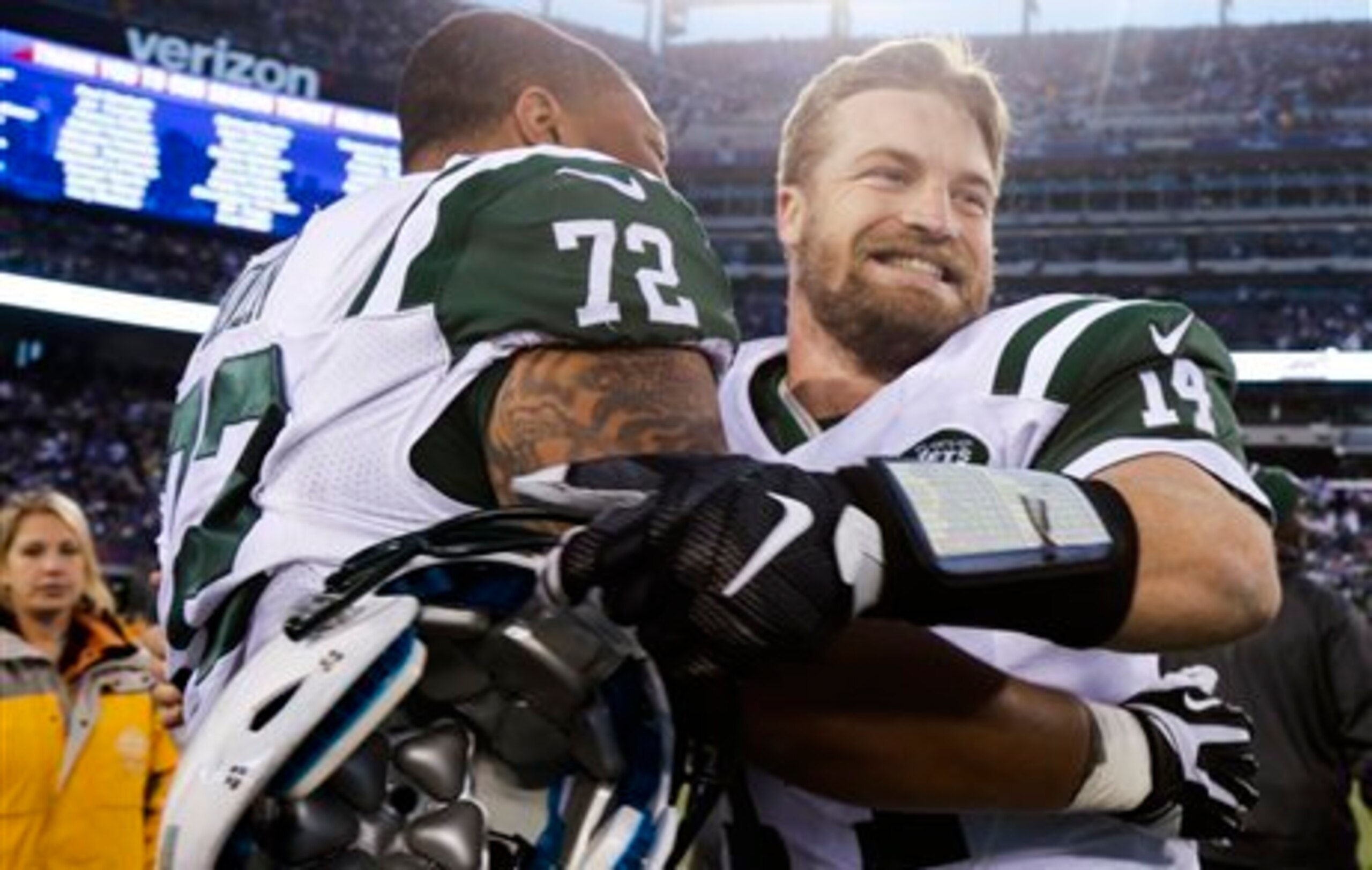 Ryan Fitzpatrick and Stephen Bowen celebrate the team's victory over the Giants.