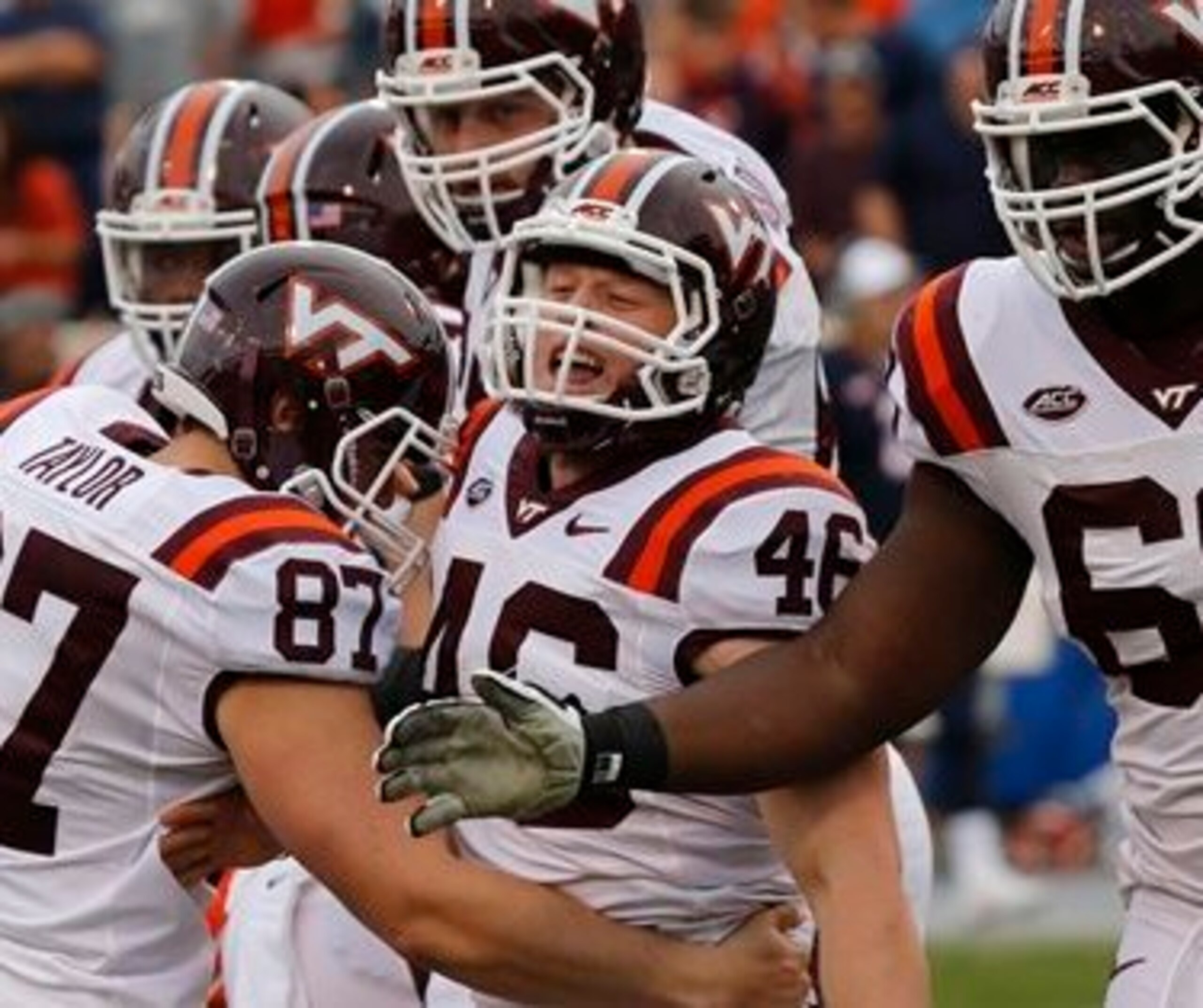 Virginia Tech kicker Joey Slye is mobbed by teammates after hitting the go-ahead kick against Virginia