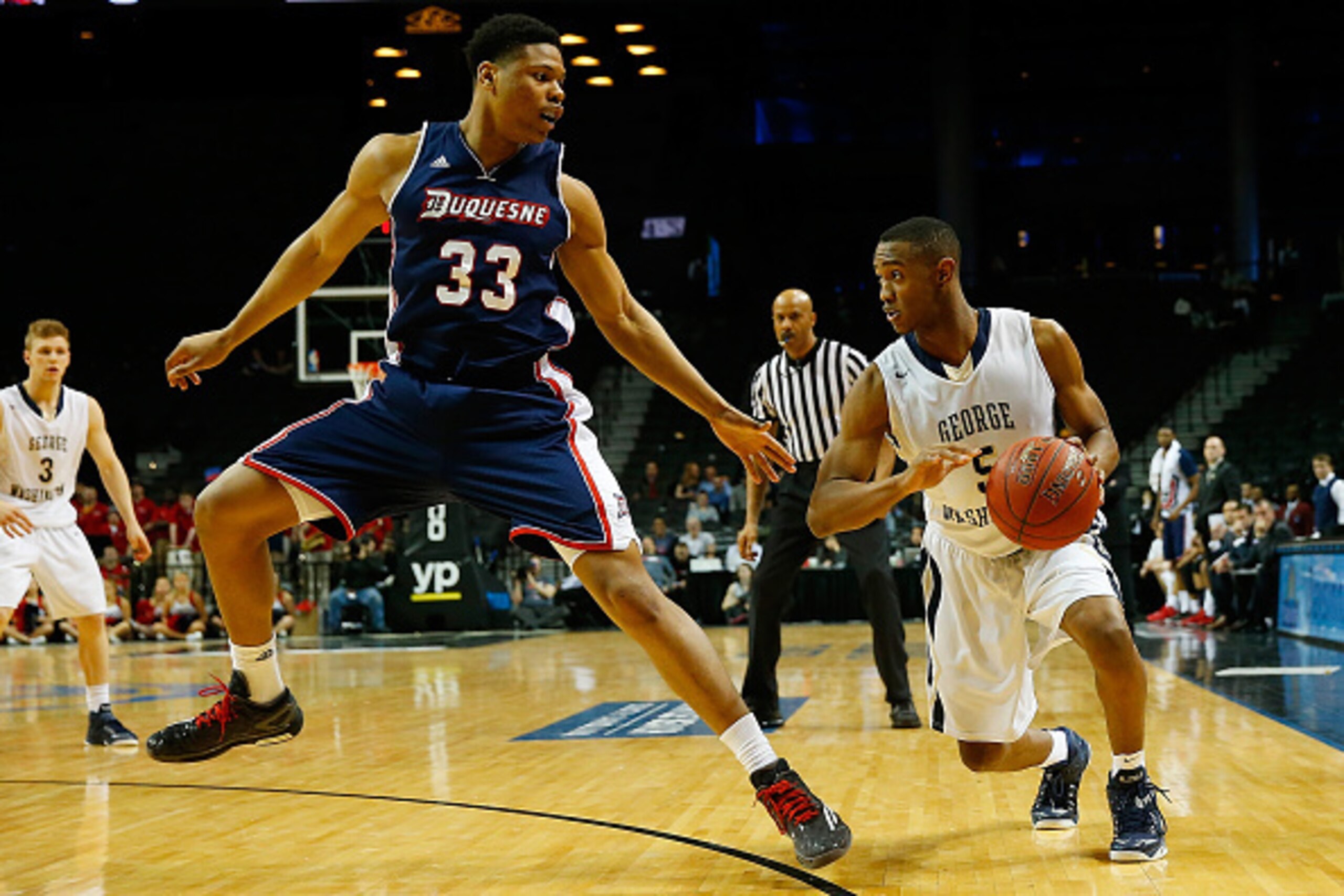 Duquesne forward L.G. Gill (left)