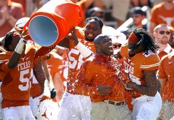 Texas HC Charlie Strong (center)