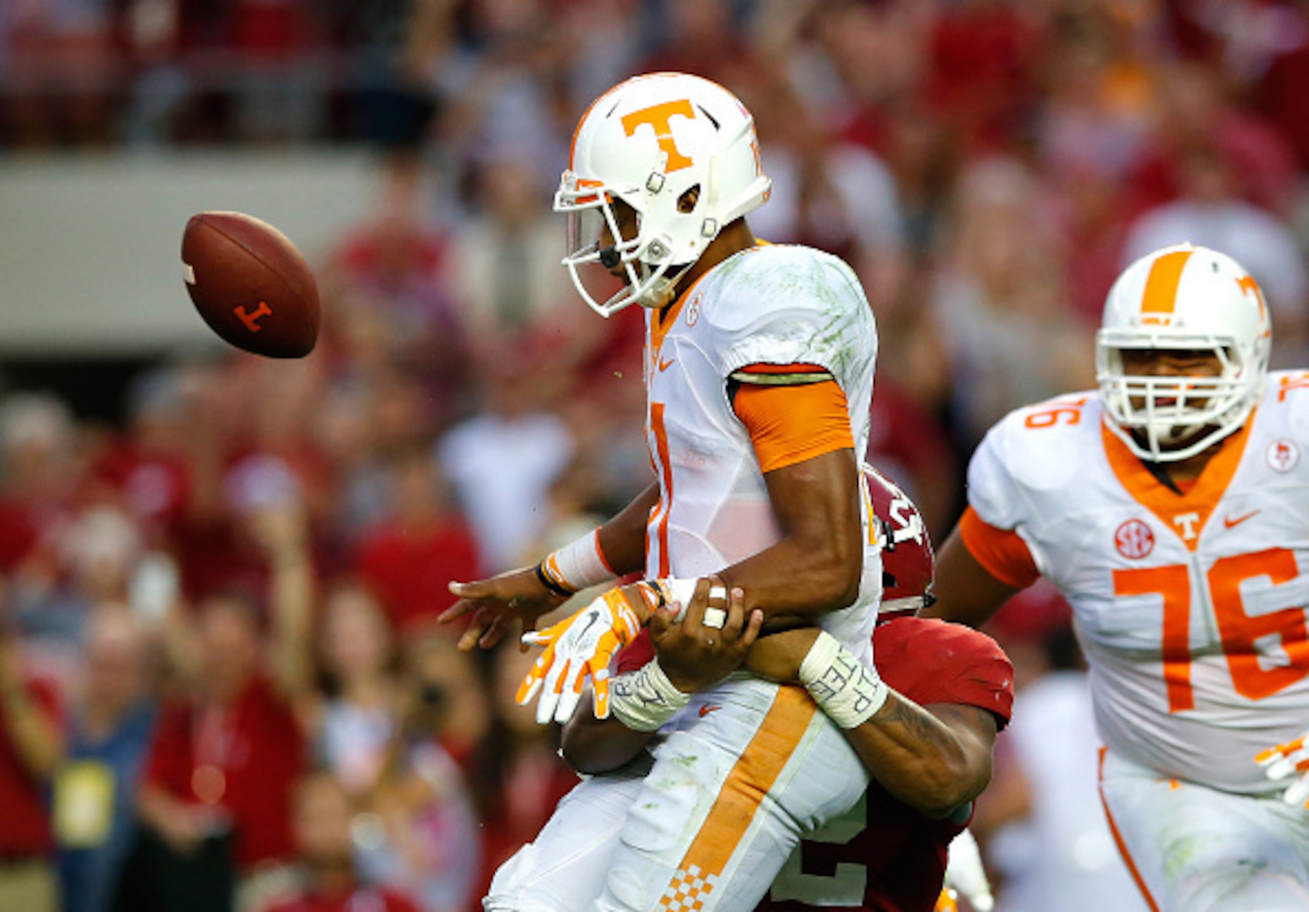 TUSCALOOSA, AL - OCTOBER 24:  Ryan Anderson #22 of the Alabama Crimson Tide forces a turnover as he tackes Joshua Dobbs #11 of the Tennessee Volunteers in the final seconds of their 19-14 win at Bryant-Denny Stadium on October 24, 2015 in Tuscaloosa, Alab
