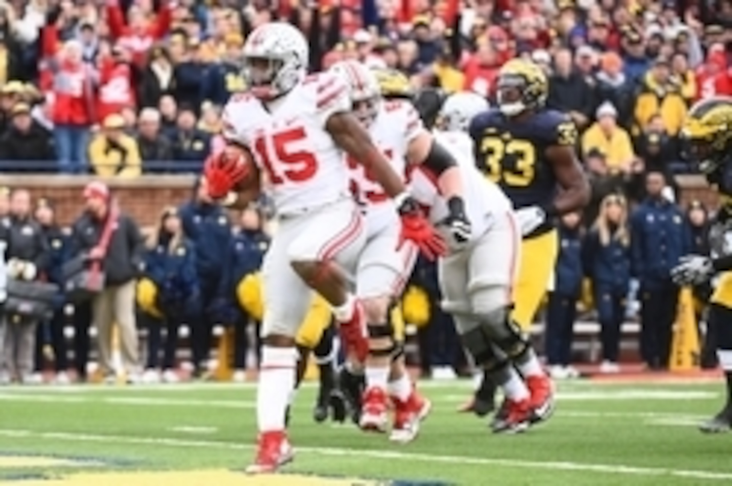 Nov 28, 2015; Ann Arbor, MI, USA; Ohio State Buckeyes running back Ezekiel Elliott (15) runs the ball to score a touchdown during the game against the Michigan Wolverines at Michigan Stadium. Mandatory Credit: Tim Fuller-USA TODAY Sports